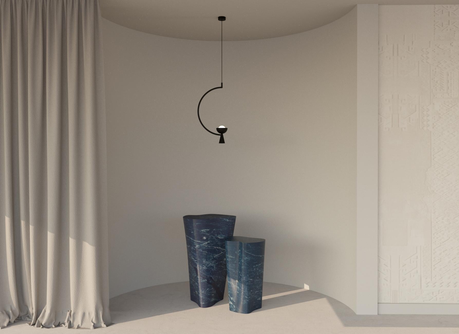 The Omen Light collection is a sculptural yet graphic collection using a distinctive chalice-like metallic shade as the main element.

The single pendant is a statement pendant that will add personality to any environement. The shade is suspended