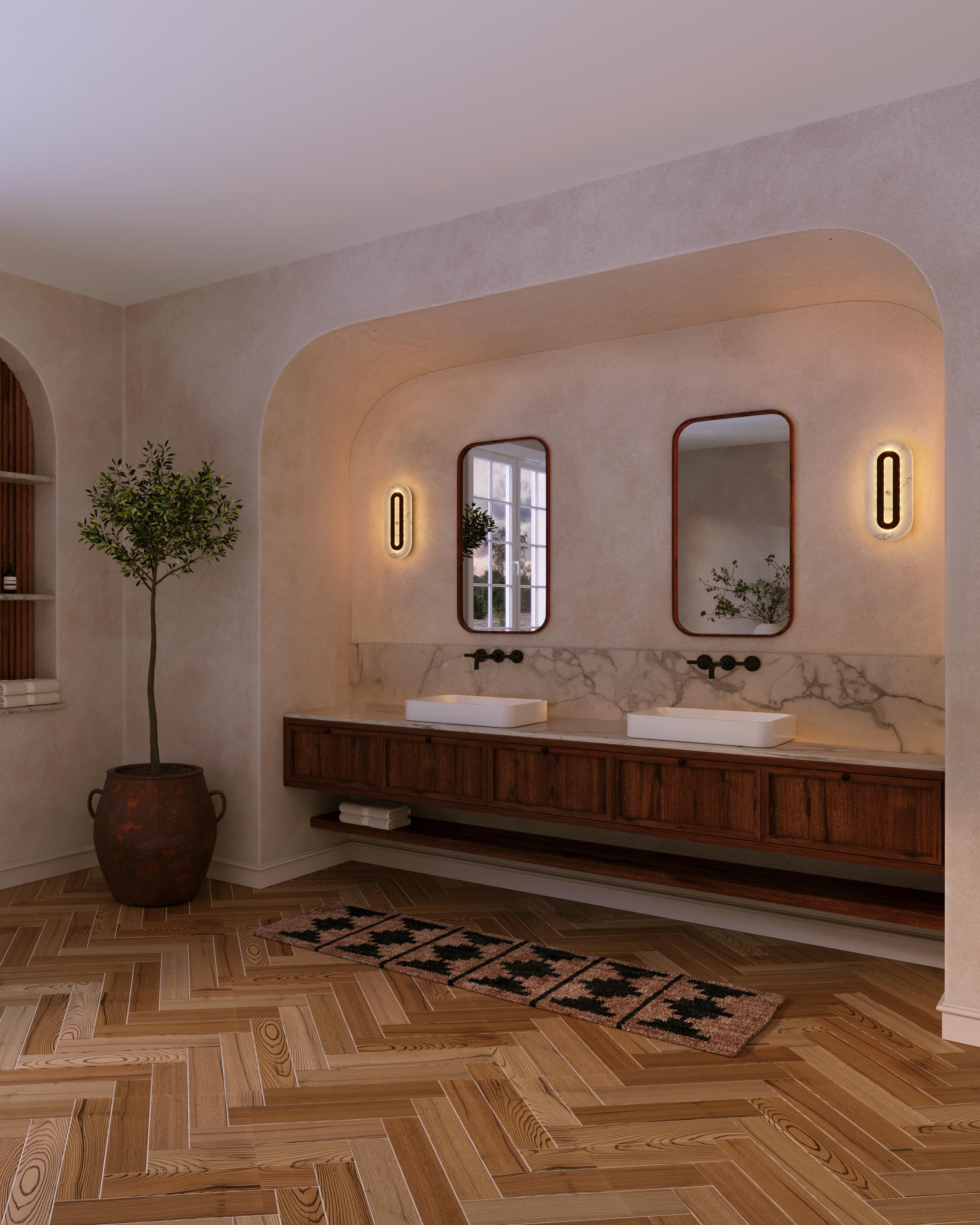 An architecturally-inspired duet of dramatic veined alabaster with a textured cast bronze – a trio of simply striking silhouettes.

Models in the collection are individually hand-crafted by the skilled artisans in our studio. Custom versions
