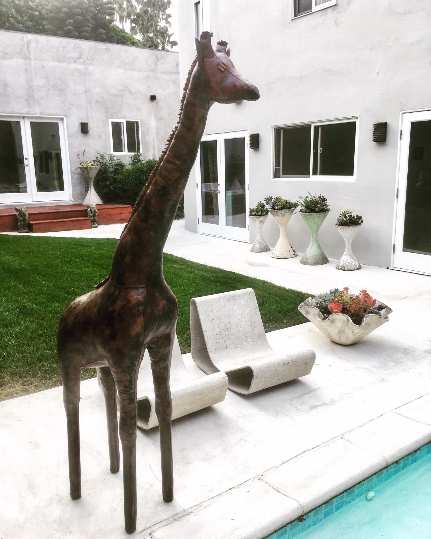 Stunning leather giraffe by Omersa. 6 feet tall! Handmade in England in the 1960s only giraffe this size listed for sale anywhere. Excellent condition. Gorgeous standalone sculpture.