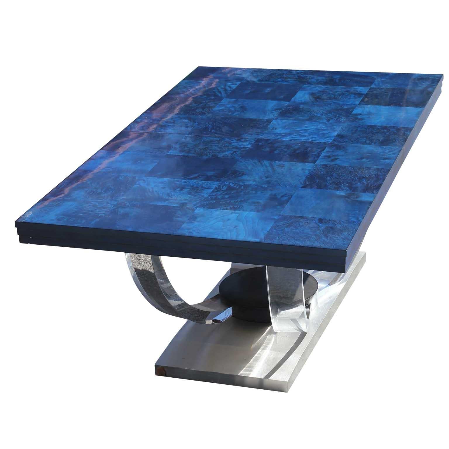 Unique Art Deco style table with sculptural acrylic legs and a silver base. The top is a blue aniline dyed burl wood. The table without the leaf sits 6 to 8 people and with the leaf is can sit 10 to 12 people.