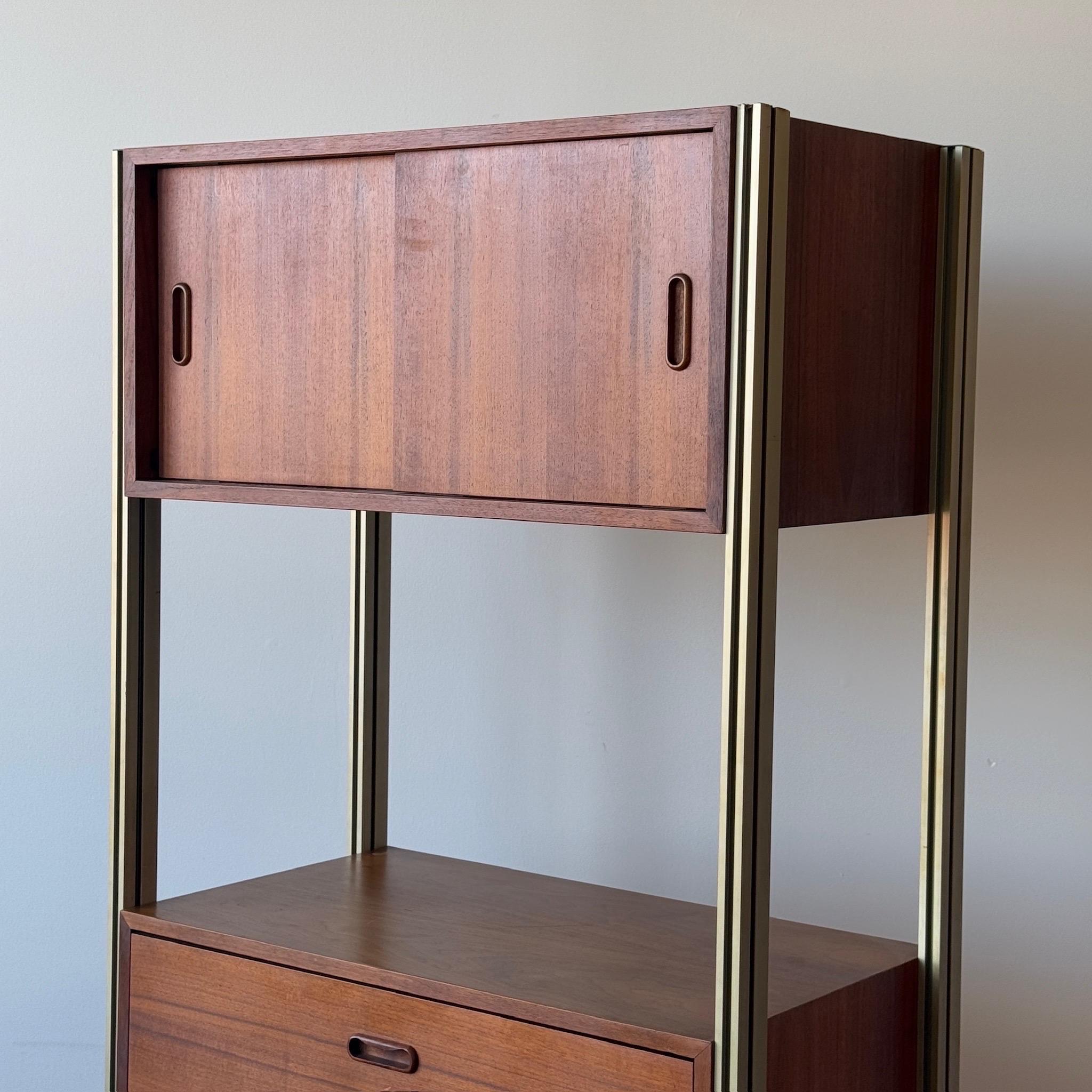 c. 1960s. Modular freestanding unit with secretary desk. Walnut wood with omni metal rods. 

