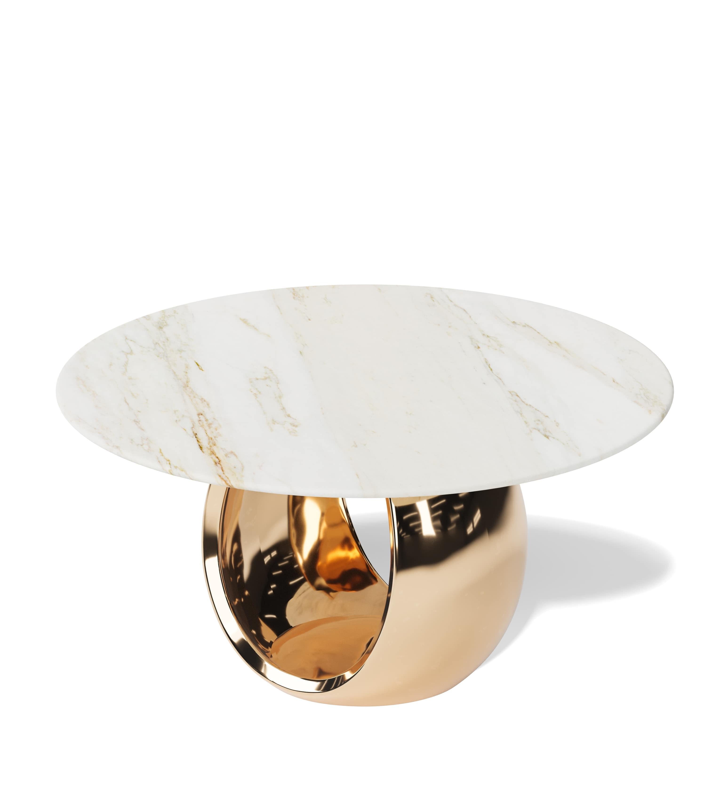Our Omnia Dining Table is a striking centrepiece that merges sculptural form with timeless materials. Featuring a solid cast bronze base and a choice of refined stone tops, this 60-inch round dining table offers an elegant balance of durability and