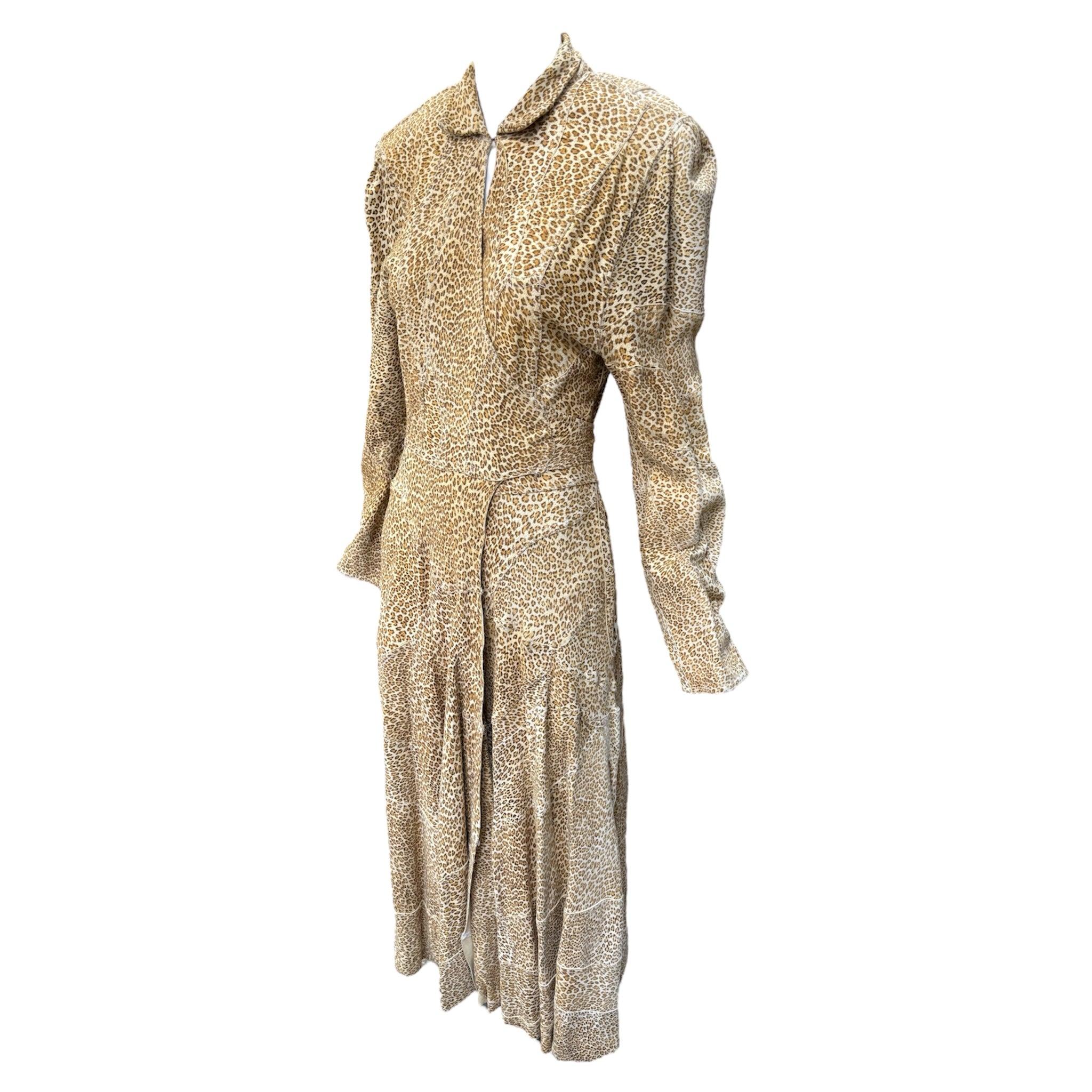 Rare! 1980's OMO Norma Kamali vintage leopard print wrap-style coat dress, made from the softest chamois leather. Princess coat fit and flare silhouette with large shoulder pads that are attached with velcro, so you could take them out for a