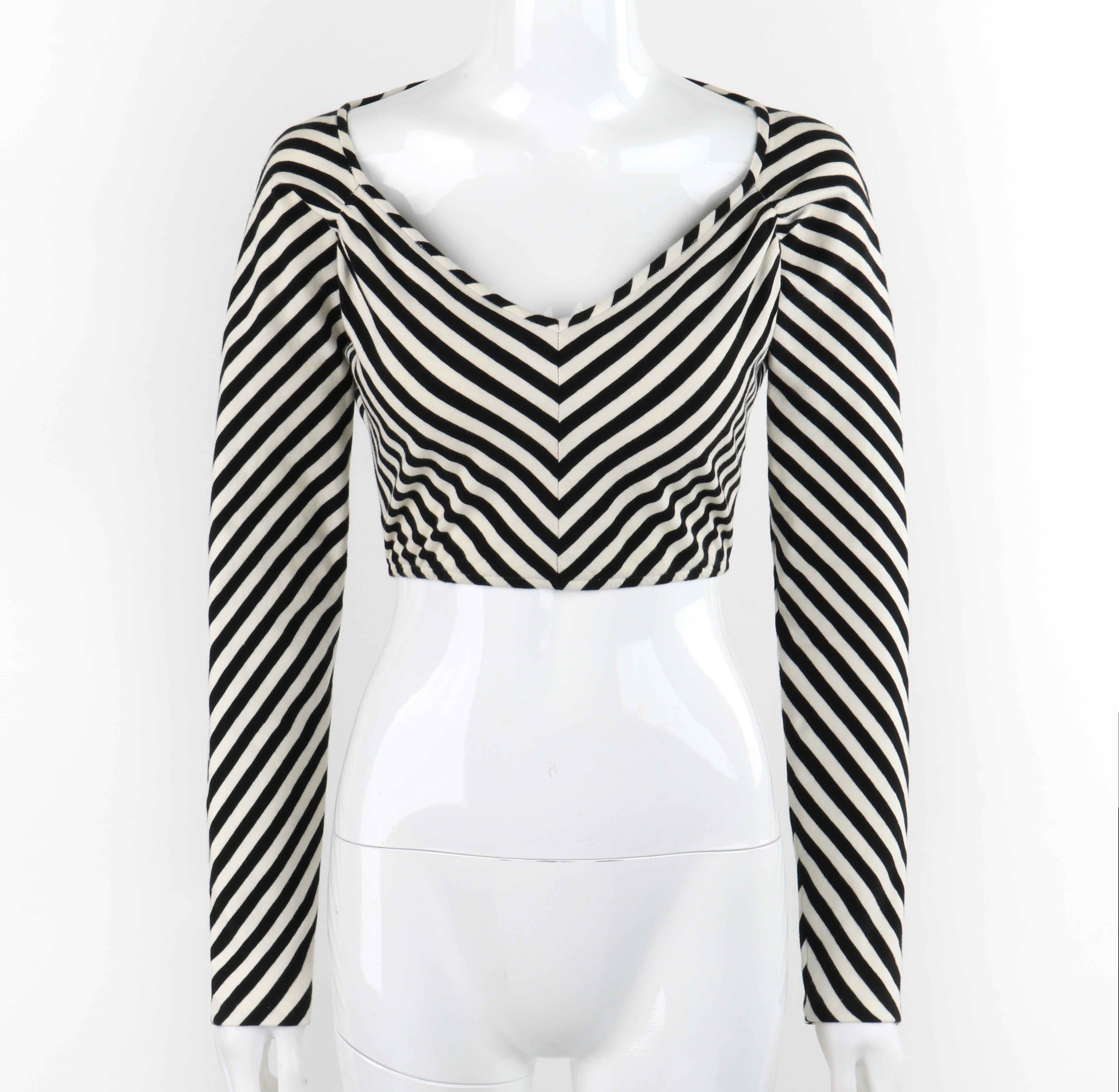 Brand / Manufacturer: OMO Norma Kamai 
Circa: 1980s
Designer: Norma Kamali
Style: Cropped long sleeve top
Color(s): Shades of black, white
Lined: No
Marked Fabric Content: 