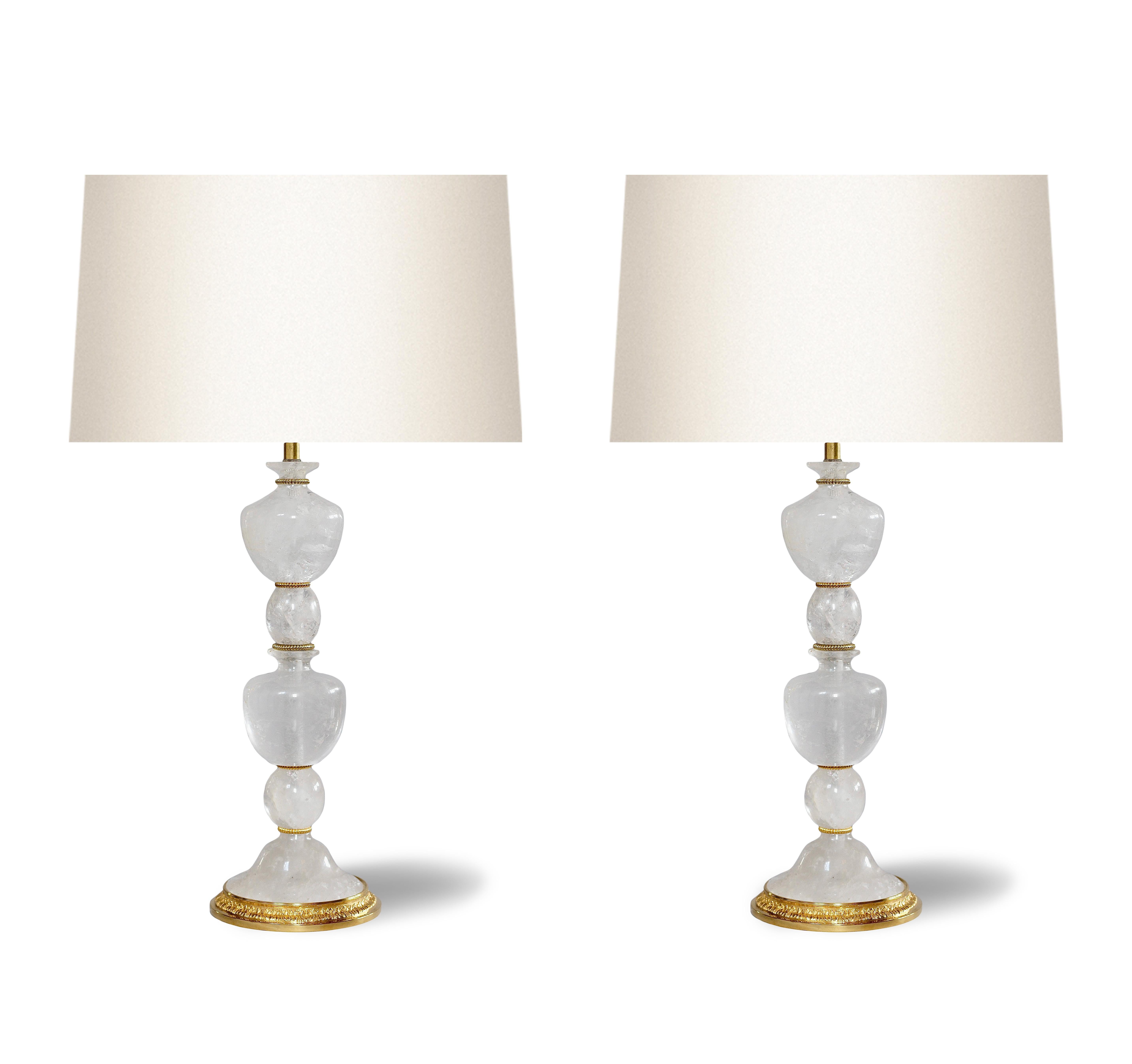 Pair of finely carved rock crystal lamps with gilt brass bases.

to the top of the rock crystal 18 inch

Created by Phoenix.

Lamp shades are not included 