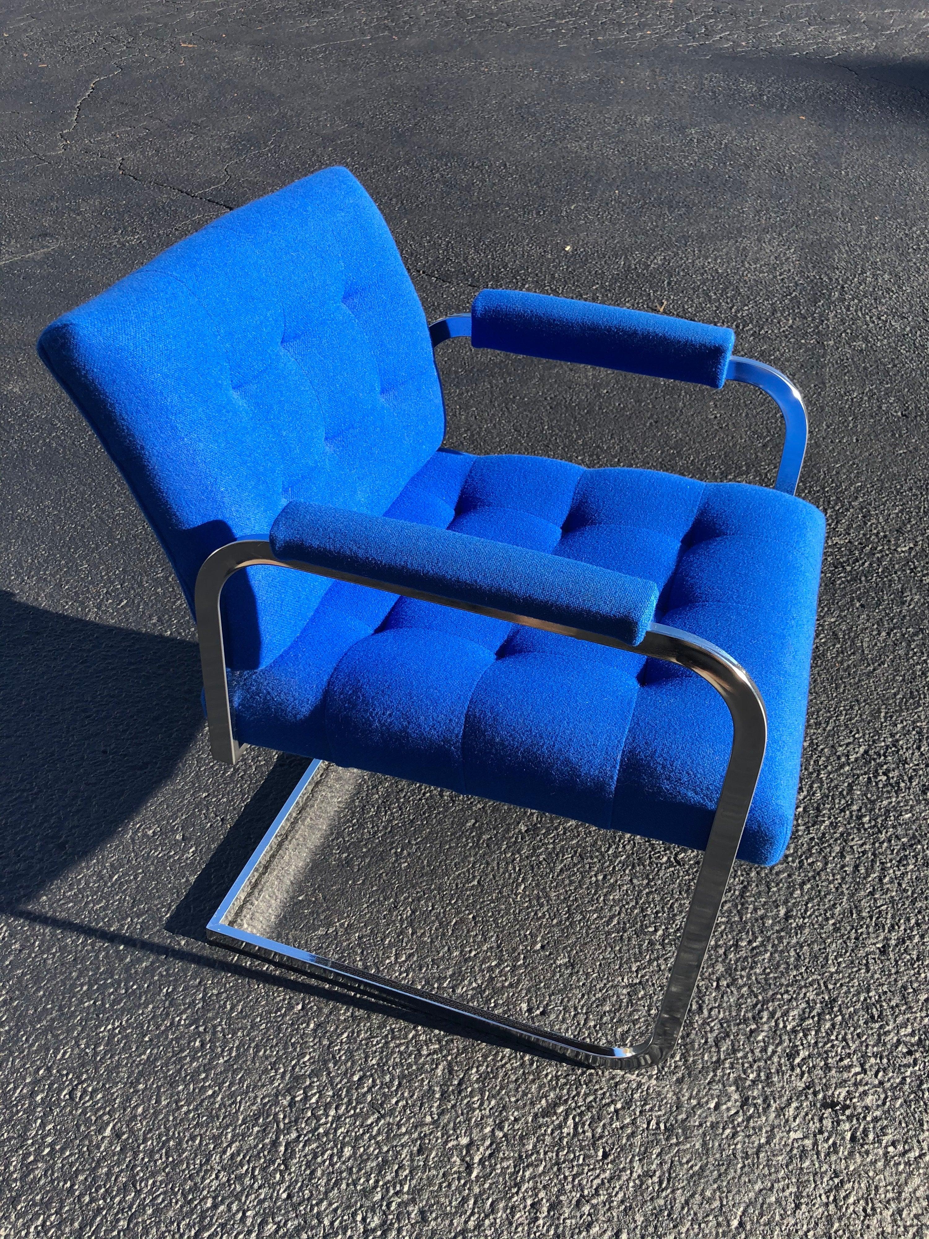 Milo Baughman style chrome armchair in original electric blue upholstery with cantilevered base. Tufted upper back for extra comfort.