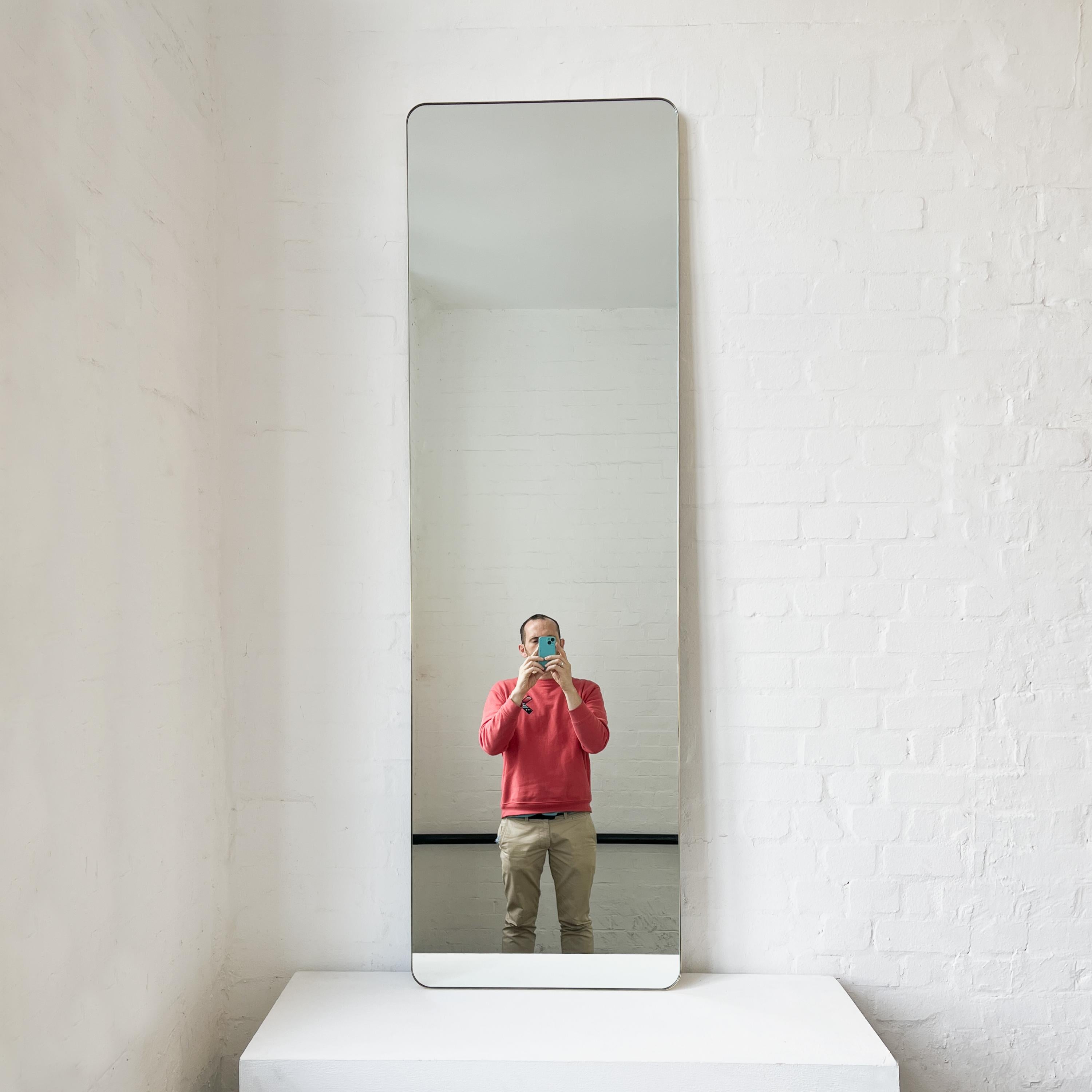 This mirror is available from stock and is part of a one-off exceptional Sale. It may be packed and shipped within 3 to 5 days of receiving an order.

Modern handcrafted Quadris™ rectangular wall leaning or wall hanging mirror with a solid brushed