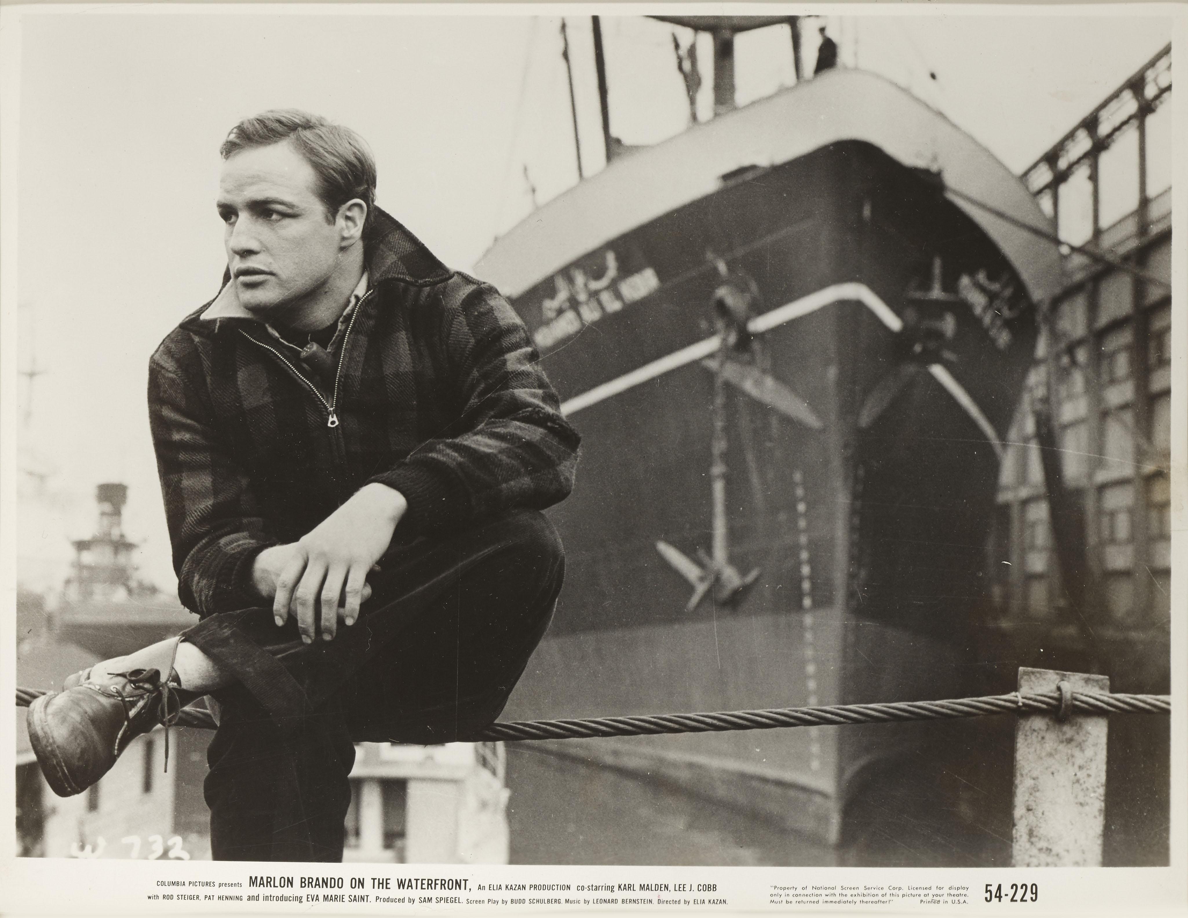 Original American photographic production still.
For the 1954 classic drama On the Waterfront. The film starred Marlon Brando, Karl Malden, Lee J Cobb. Guinness. This film was directed by Elia Kazan.
This piece is framed in a Sapele wood frame with