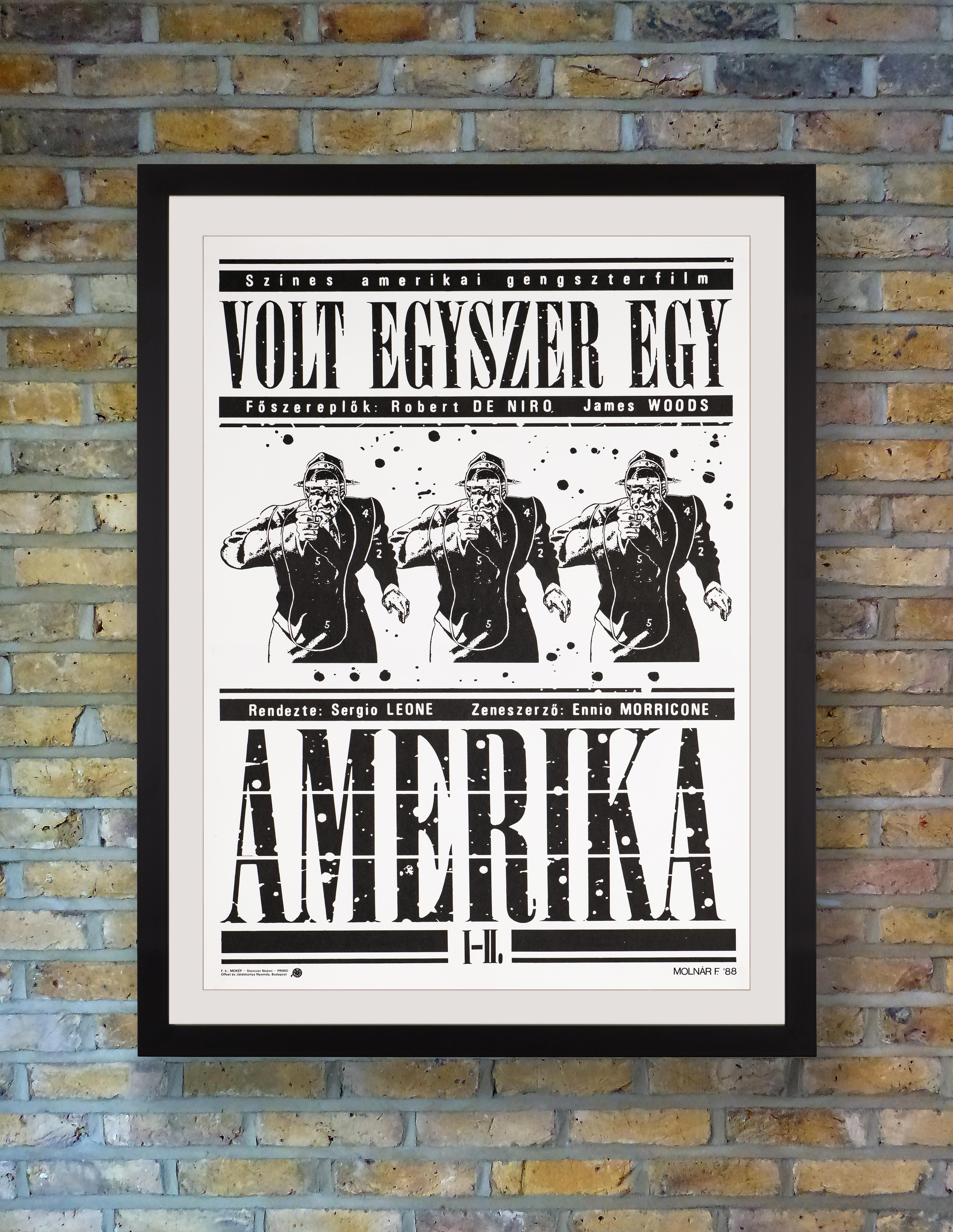 Artist Ferenc Molnár confronts us with a gun-toting gangster in triplicate on his splattered monochrome poster for the first Hungarian release of the sprawling 1984 crime epic 'Once Upon a Time in America.' Starring Robert De Niro and James Woods,