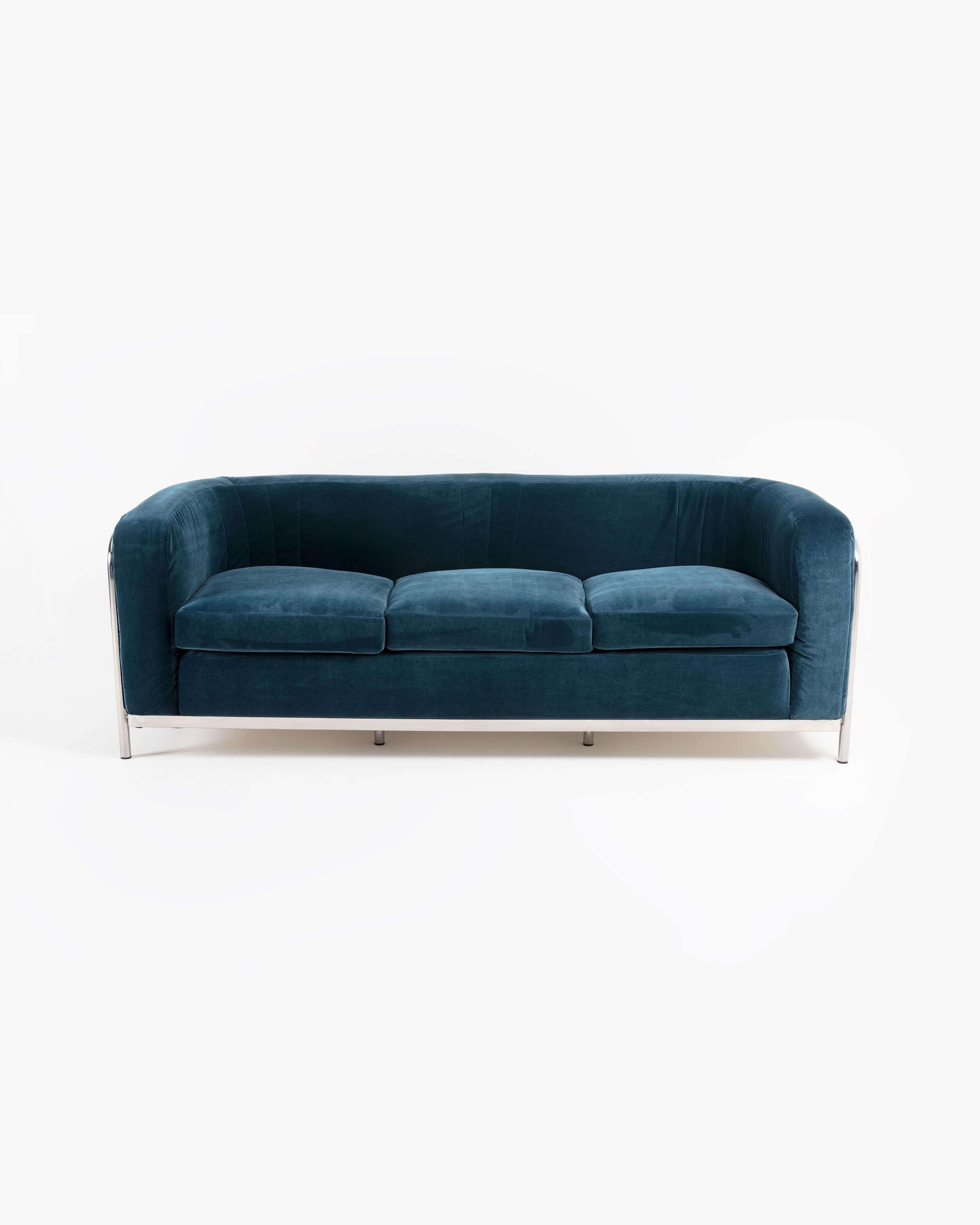 The Onda three-seat sofa–Onda meaning “wave” in Italian–by Jonathan de Pas, Donato D'Urbino and Paolo Lomazzi, earns its namesake from the tubular stainless steel frame that forms its support structure, curving in and out along the back of the seat.