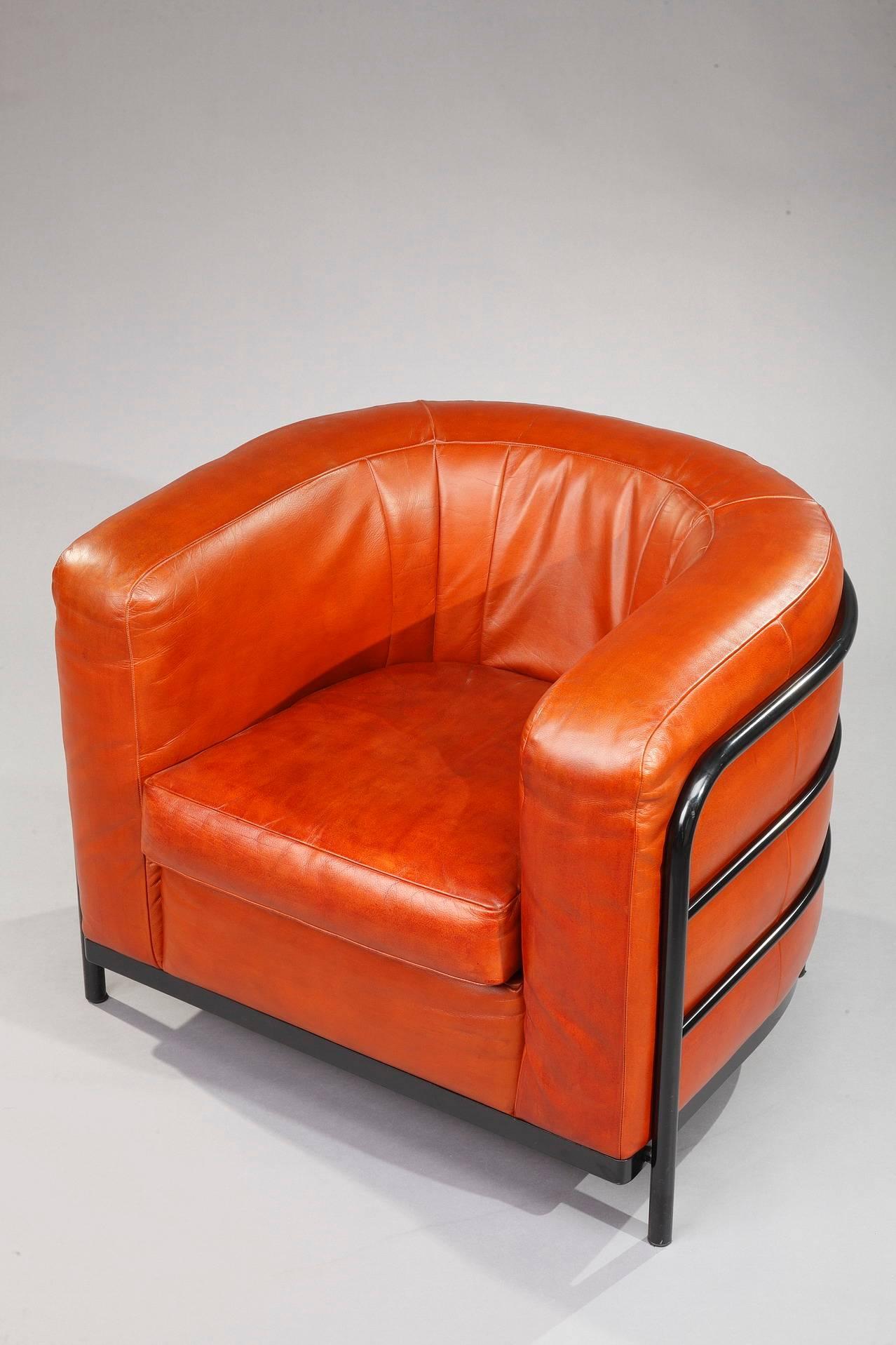 Onda armchair in orange leather designed by Jonathan de Pas, Donato D’Urbino and Paolo Lomazzi in 1985 for the Italian manufacturer Zanotta. Black lacquered metal structure and feet. Labelled by Zanotta Italy and numbered. Five chairs