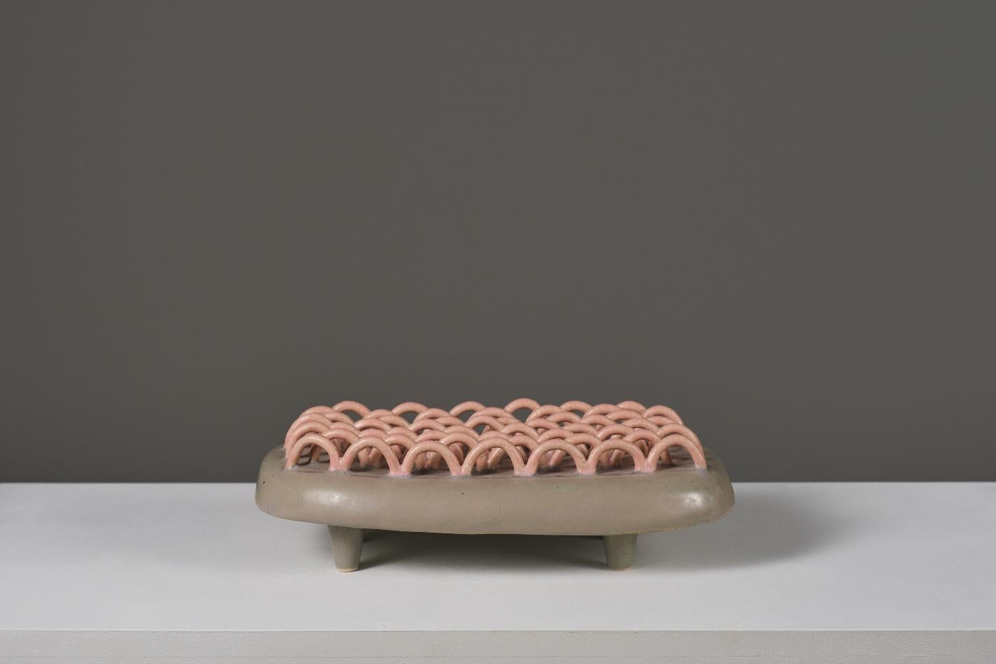 Working from ceramics as a broad discipline that includes design, sculpture and painting, this work belongs to a collection of objects in which the forceful volumetries dialogue with fragility, balance and color.

She has a degree on Ceramic and