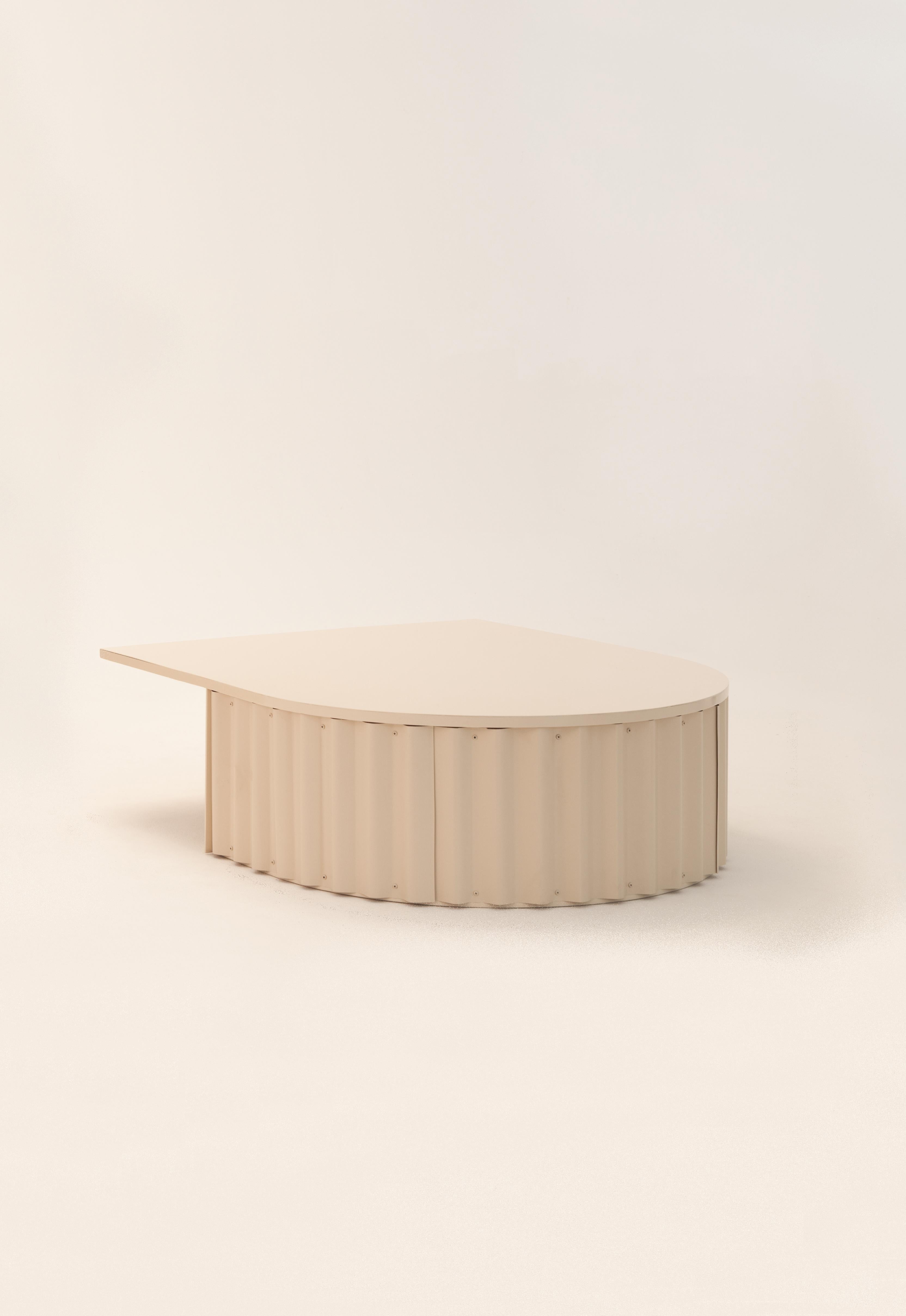 Ondula coffee table by Flatwig Studio 

Dimensions: L 100 x D 119.8 x H 35 cm
Materials: Iron structure, corrugated aluminium sheet
Colour: nude
Other colours (RAL Classic and RAL Design) are available on request. Please get in touch about the