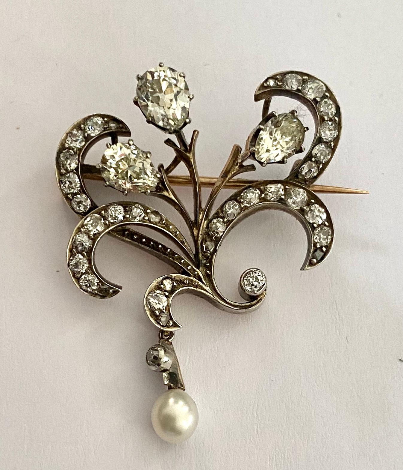 One  (1) 14K. Yellow Gold and Silver  Diamond Brooch 
Signed: VDS+ = Workmaster: S.van der Sluis Utrecht ca 1925
set with:
3 pear shape natural diamonds
35 old Europena and rose cut diamonds
Total weight of diamonds: 3.00 ct.  VSI/Wesselton-Cristal