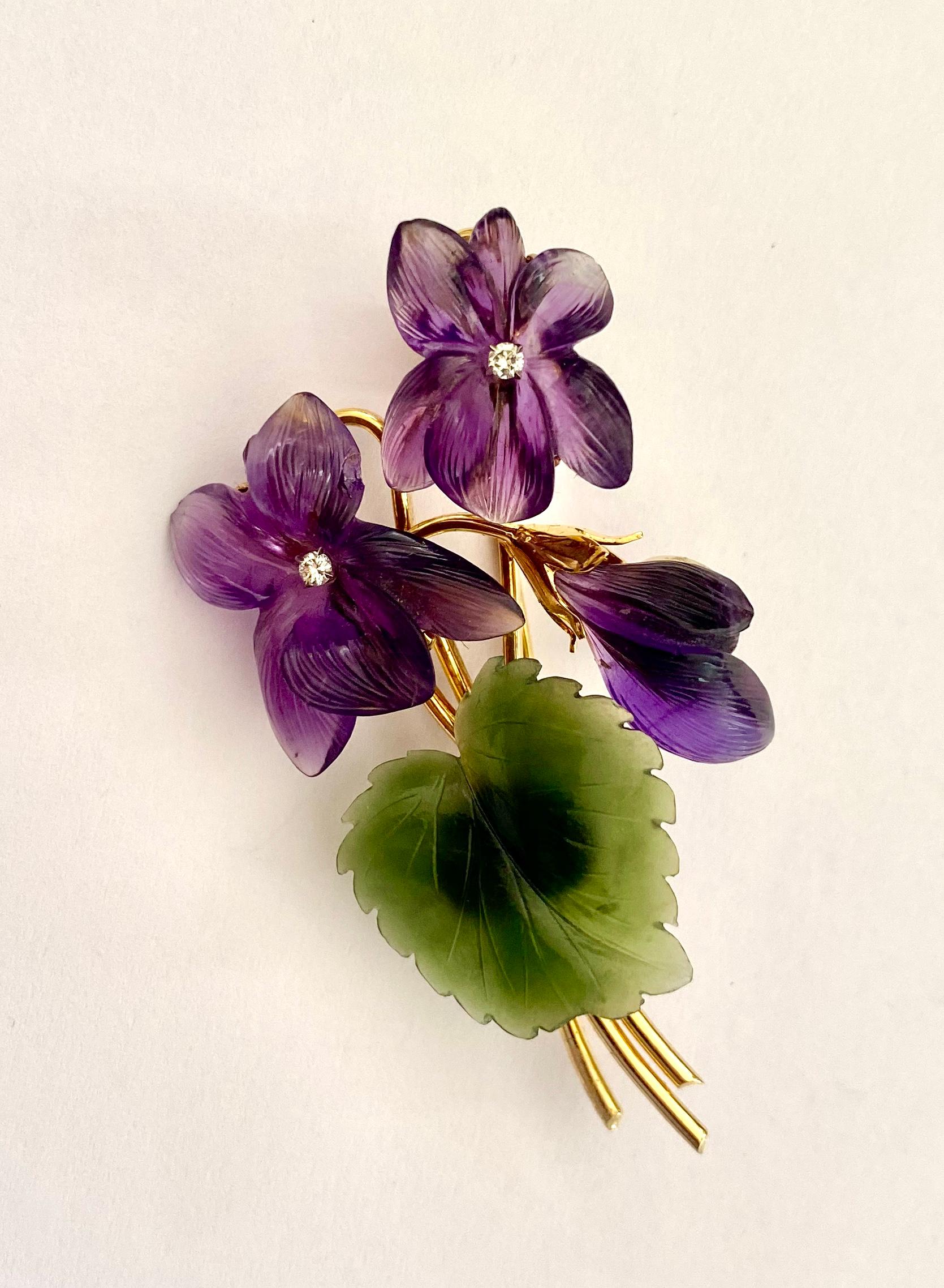 One (1) 18K. Yellow Gold Flower Bouquet Brooch,  Vienna 1960
set with:
Natural Nephrite (Jadiet) Green   (1x)
Natural Amethist (Quartz) Purple  (3x)
Natural Diamond (0.05ct) VS/SI I-J  (2x)
stamped  750 (incl. Dutch Garantee stamp) and A.S = Armold