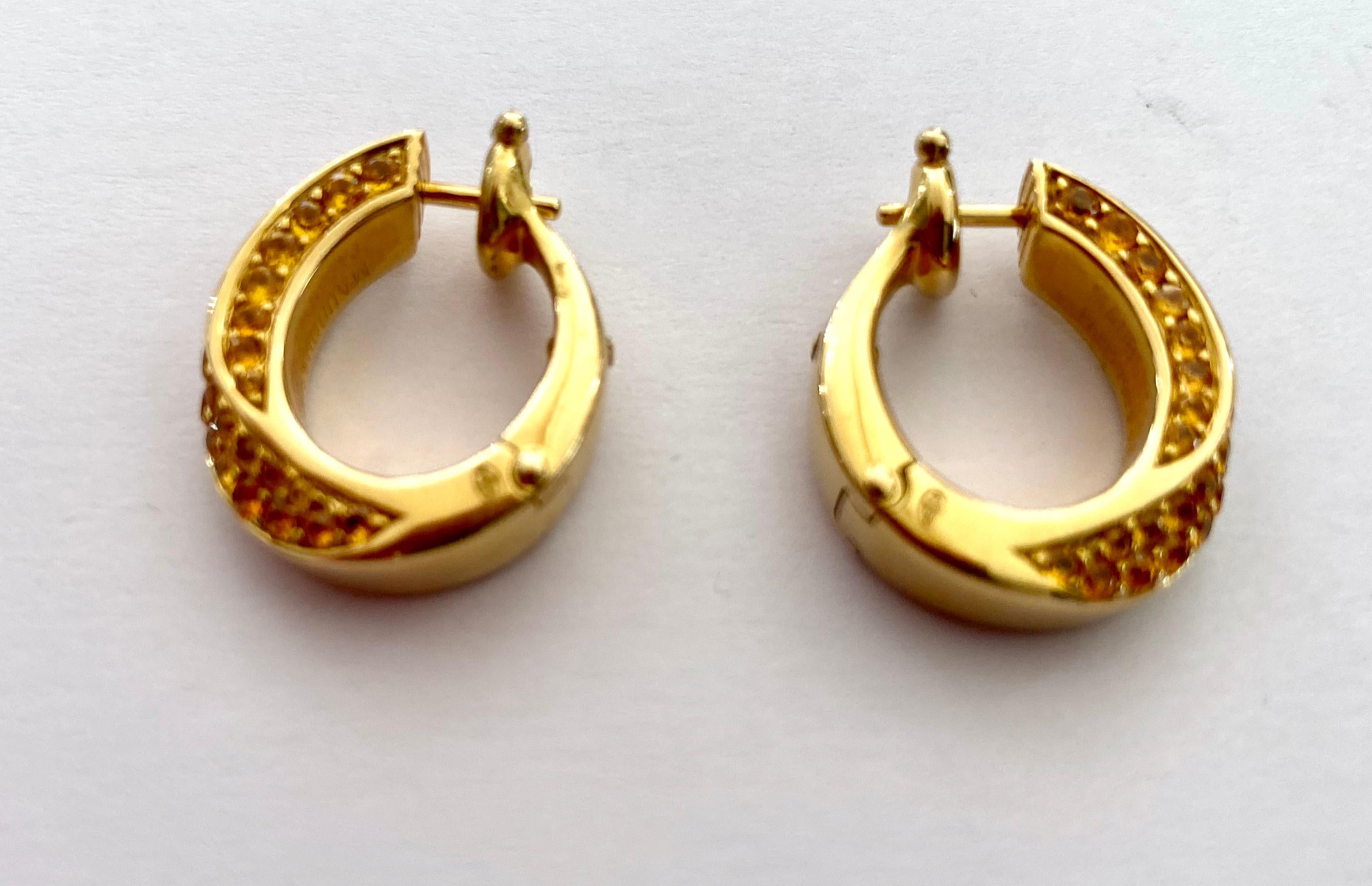 One (1) Pair of 18K. Yellow Gold Earrings, set with 90 Natural Yellow Sapphires.
Signed: 750 MAUBOUSSIN  Paris 750  E1621
90 round mix cut Natural Yellow Sapphires = 2.34 ct (Vived Yellow)  No heating
