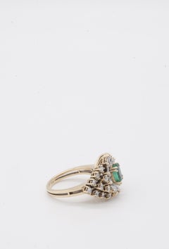 One 14kt Ladies Stamped Emerald and Diamond Ring