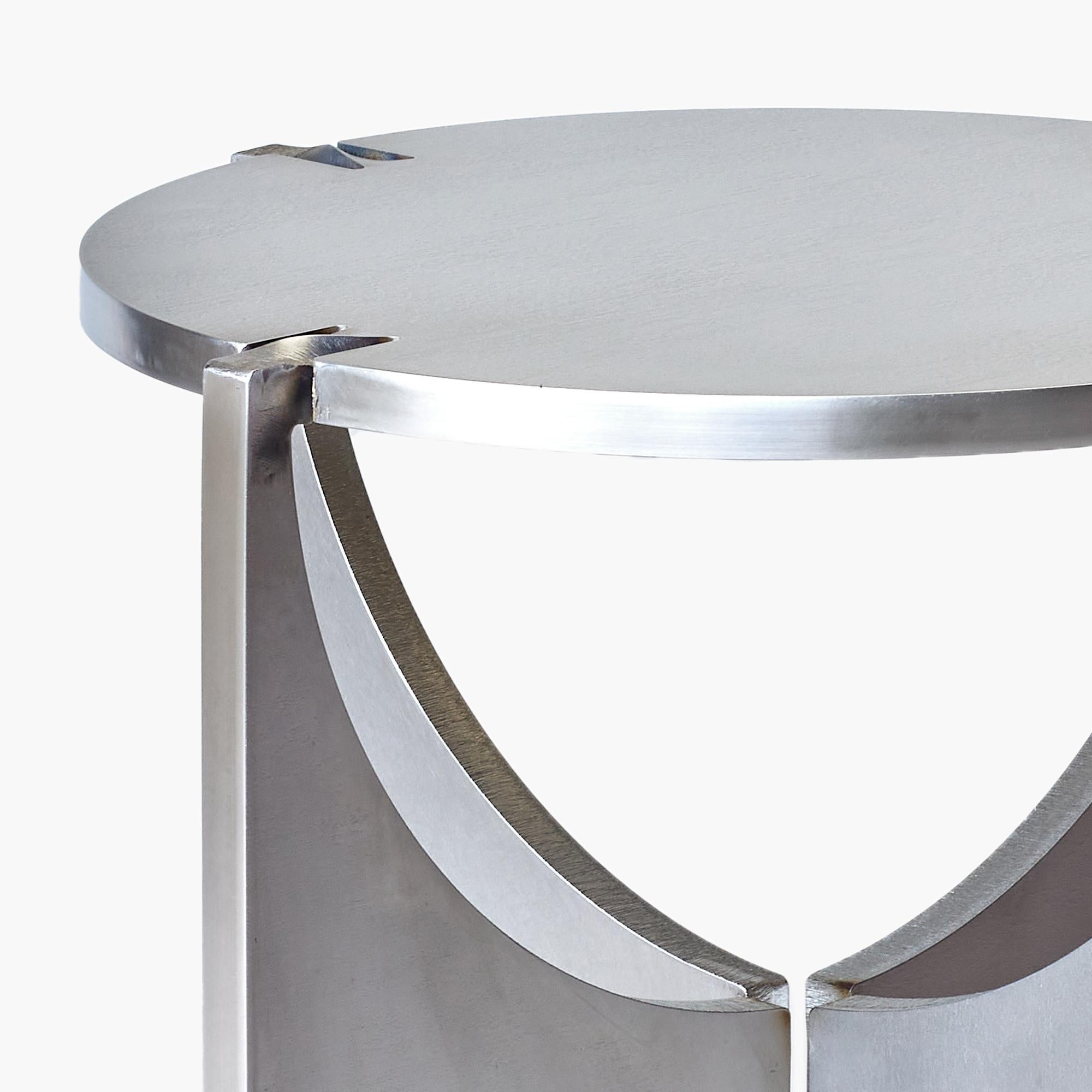 Introducing the ONE Round Stool, a testament to simplicity and strength within the ONE family. Crafted from a single sheet of metal, it undergoes a transformative journey from a flat surface to a dynamic three-dimensional form, echoing the