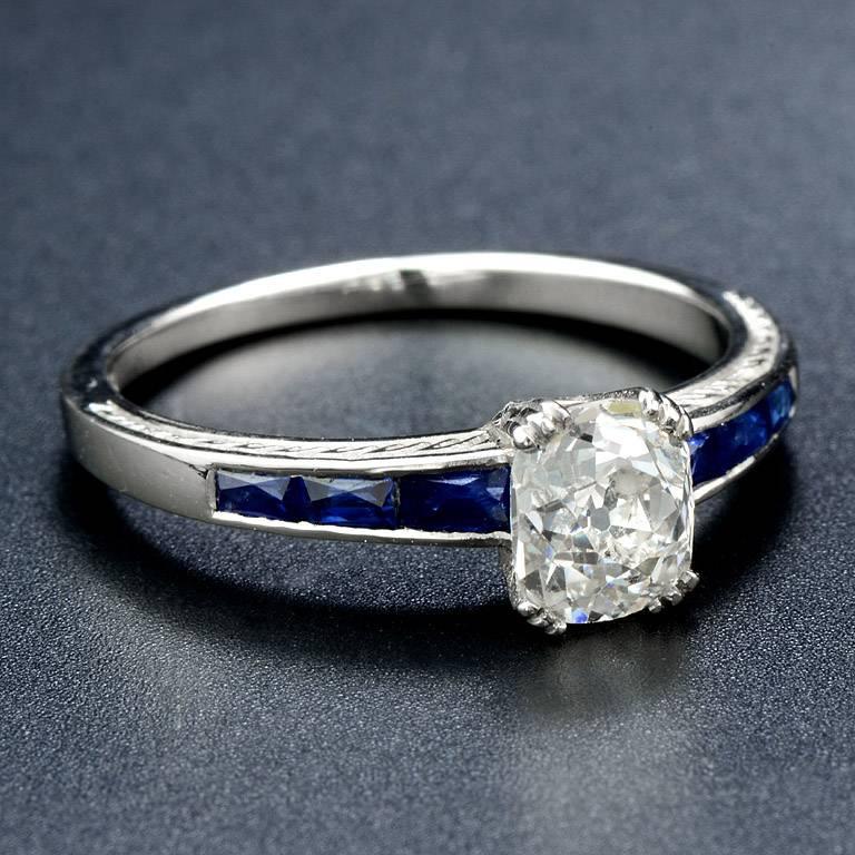A perfect 1.00 Carat Old European Cut Diamond set with French Cut Thai Sapphire total 6 pieces weight 0.95 Carat on the shanks.

The ring was made in size US.#7

