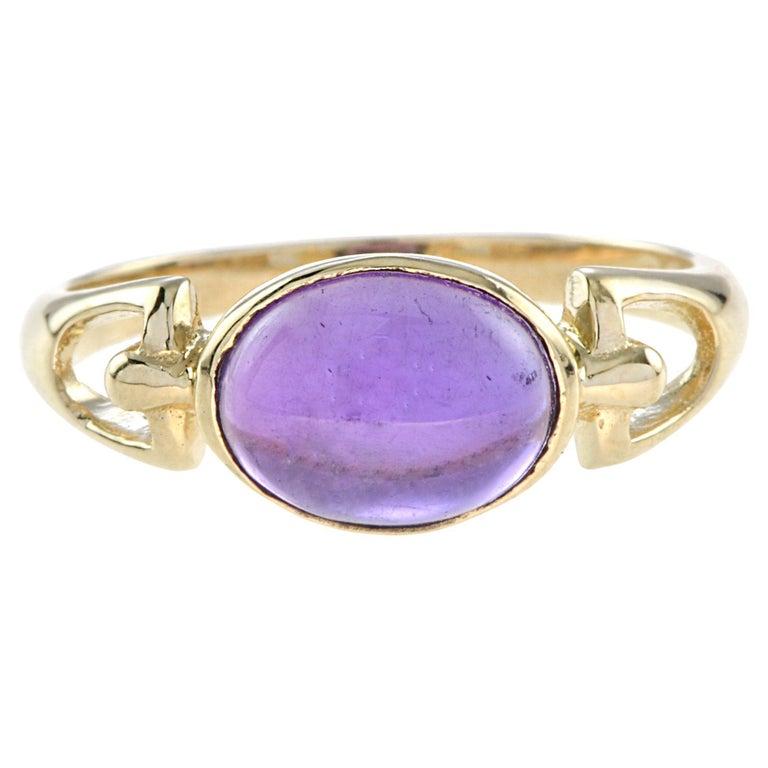 Amethyst traditionally worn to instill a sober and serious mind, is the stone worn by bishops, the color echoing their purple robes. This classic design ring features oval cabochon amethyst set in 14K yellow gold.
Ring Information
Style: Classic
