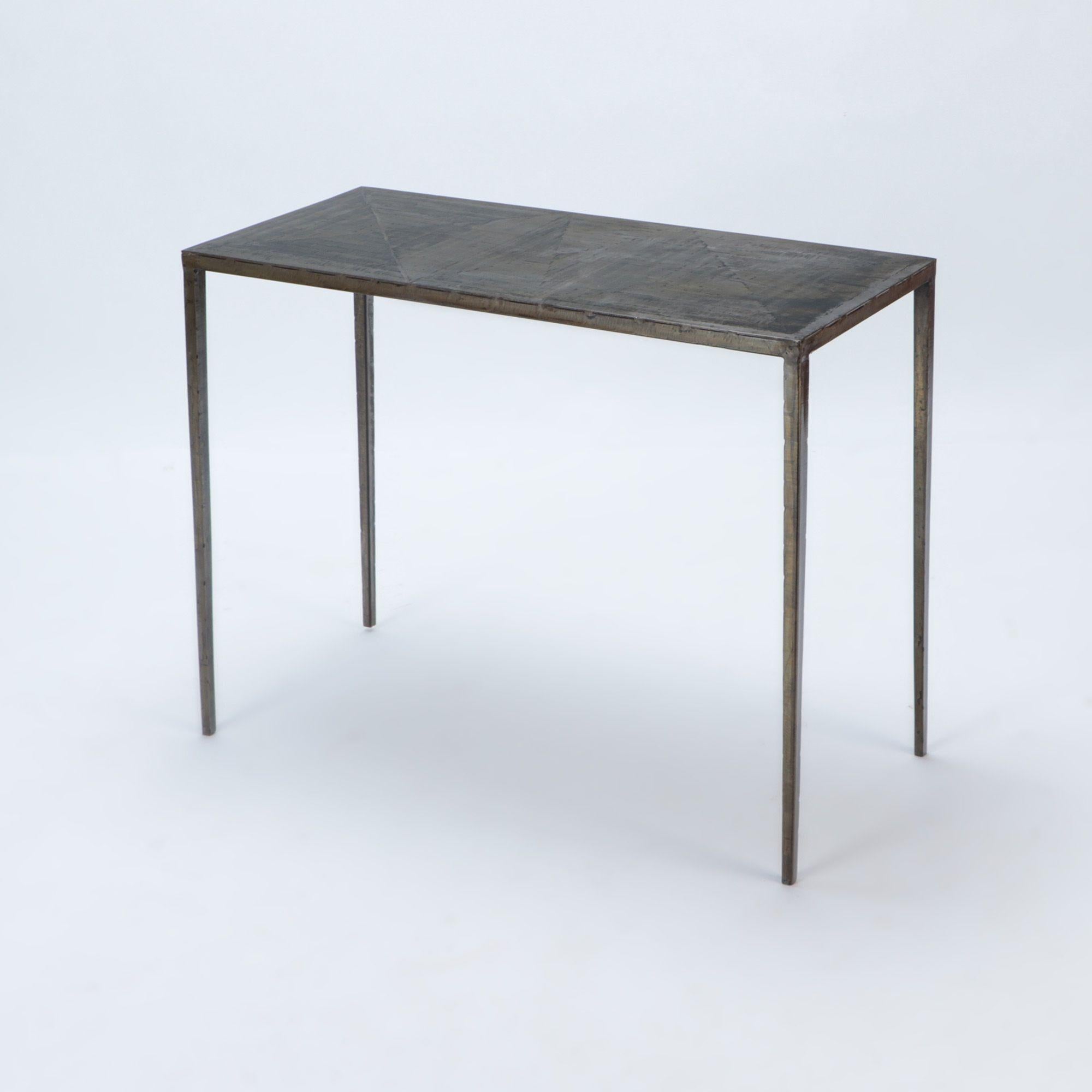 A wrought iron console with bronze wash and slender matte black wrought iron bases. In the manner of Jean-Michel Frank. Contemporary.