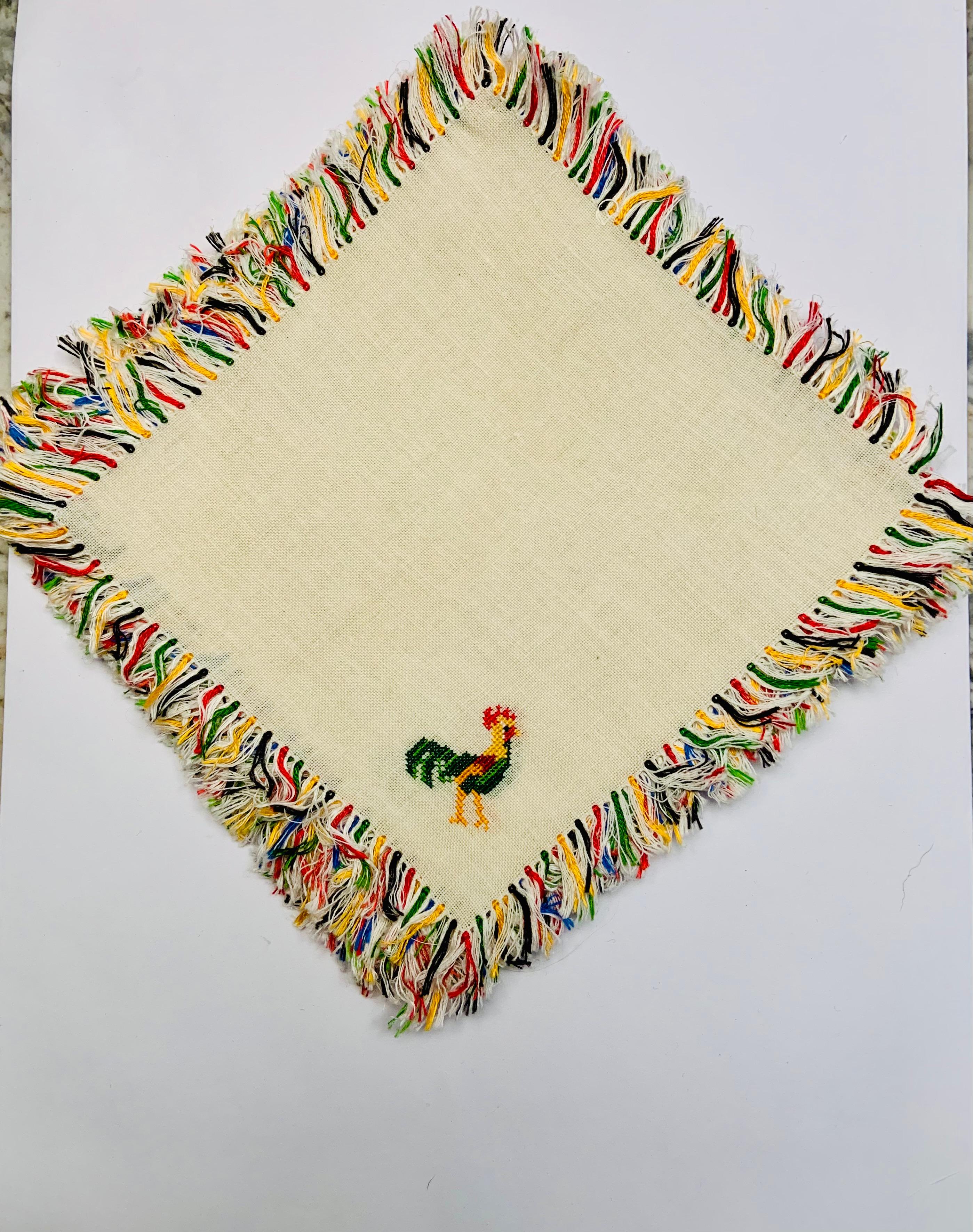 The cockerel is the unofficial mascot of Happy Hour. This set of twelve cocktail napkins has a multi color rooster in one corner and a matching fringe all around. The set has never been used and is in excellent condition.
Measurements;   Length 6.5
