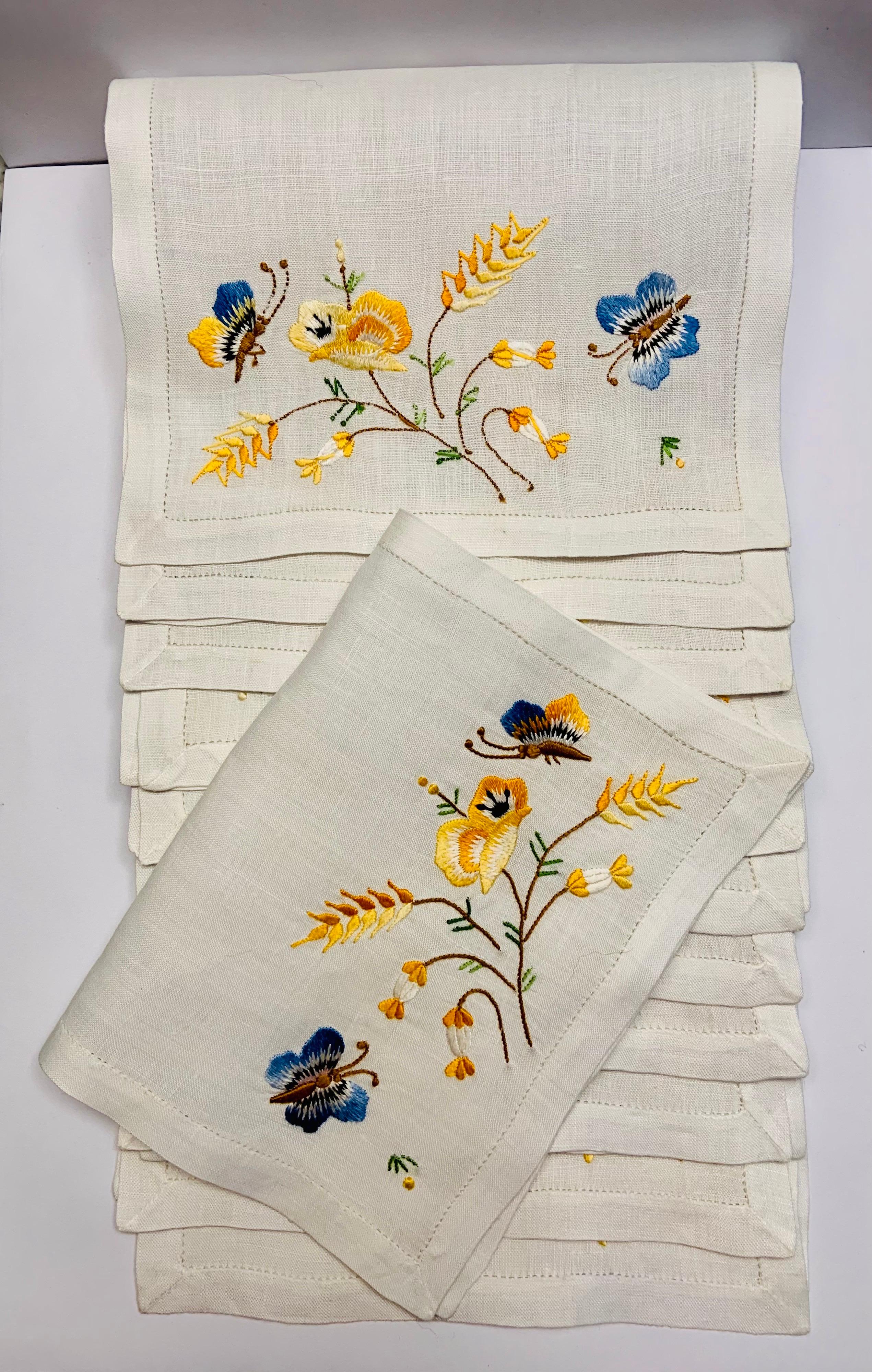 These pristine linen cocktail napkins are hand embroidered with multi color silk thread depicting two butterflies and a 
charming bouquet of yellow flowers.  The set of twelve are in excellent condition and appear to unused.
Measurements;   Height
