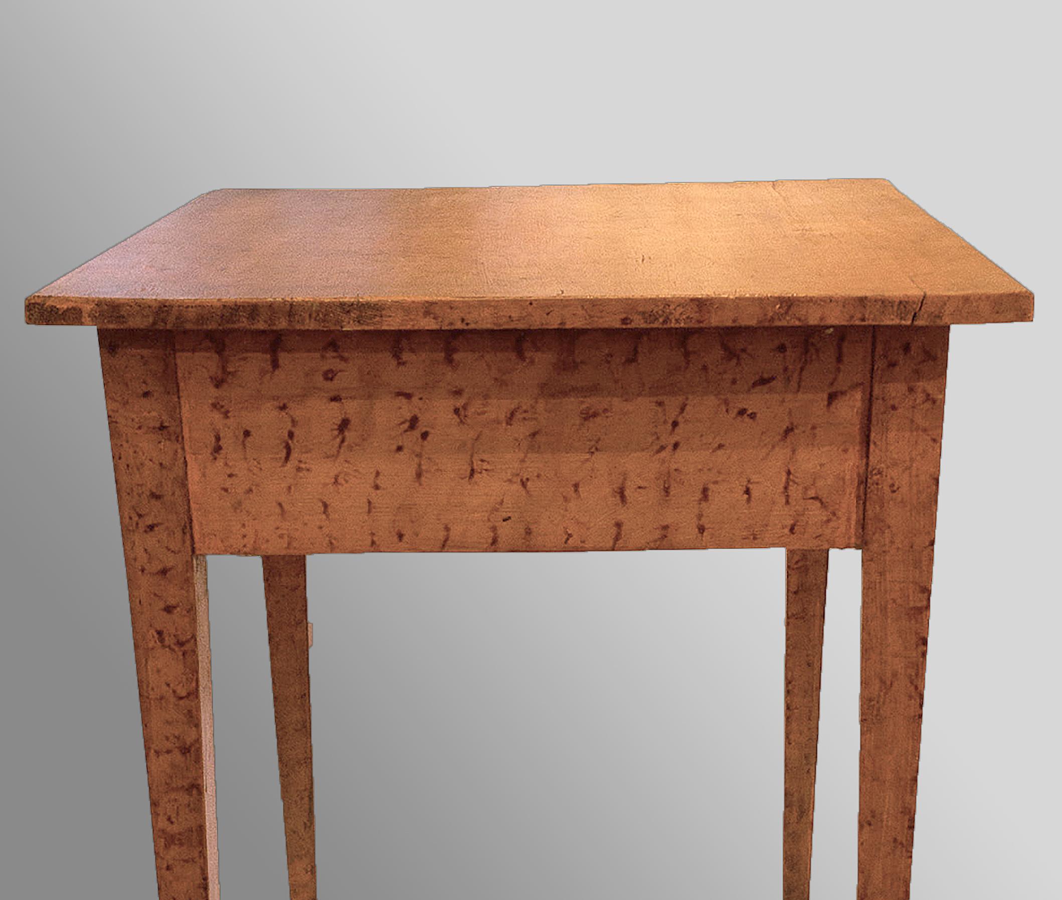 One drawer with wooden pull with salmon sponge paint decoration on squared tapered legs. Original paint made of walnut and poplar. Berks County, circa 1820.

Measures: 30 ½” x 24” x 23 ¾”.