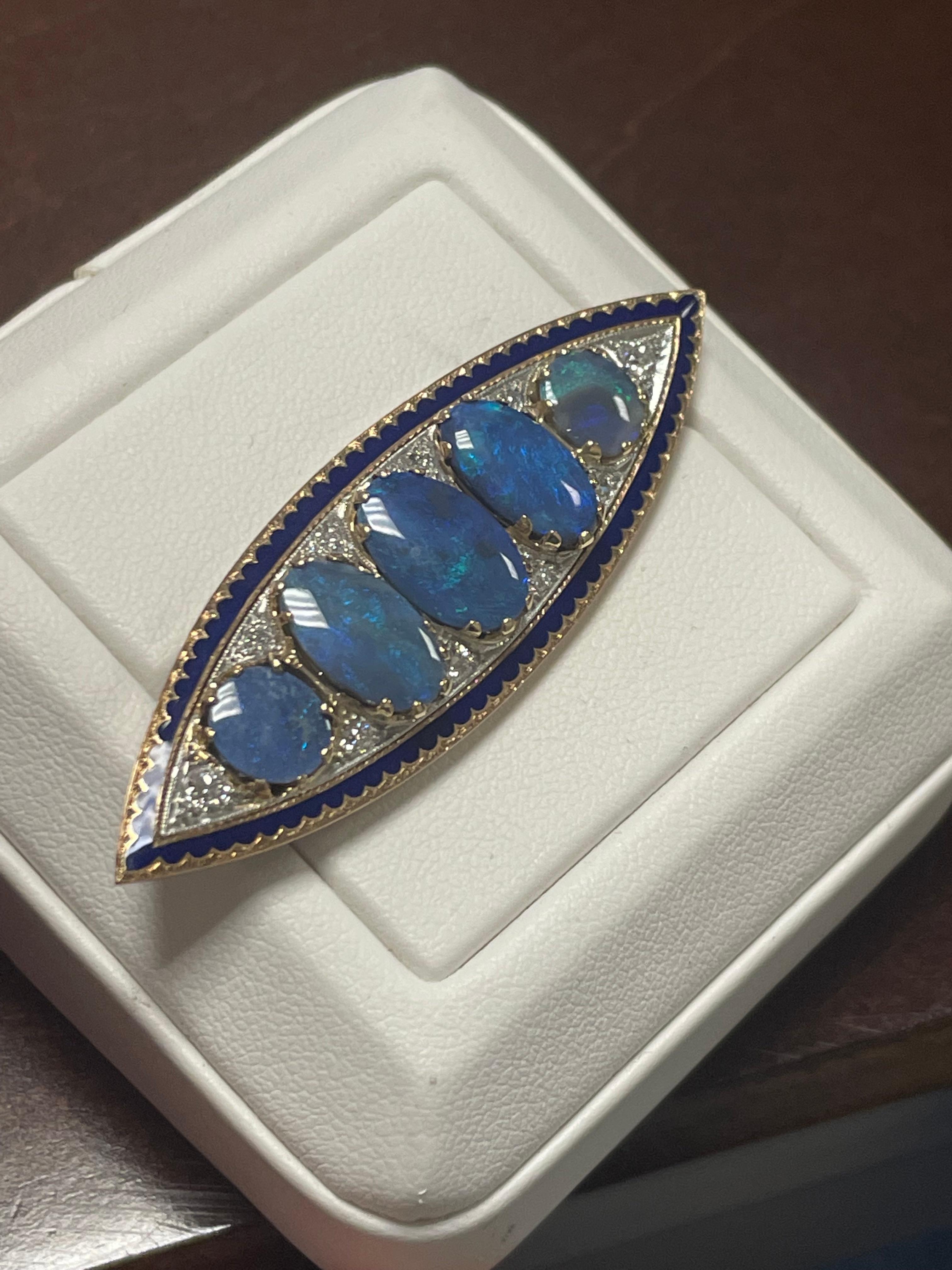 One Lady's five black opal with blue enamel, and diamonds broach in 15k yellow gold.  Bright, cabochon shape with fire pattern.  Brightness of fire and saturation with blue only.  Measurements are (1) 13.0mm x 8.0mm, (2) 11.6 x 6.0 (2) 7.0 mm in