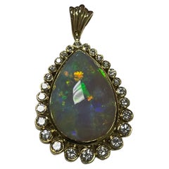 One Lady's Opal and Pendant in 14k Yellow Gold 