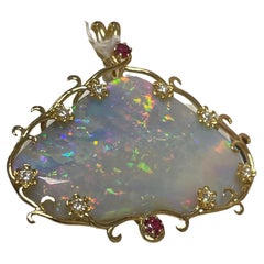 One Lady's Opal, Diamonds and Rubies Pendant