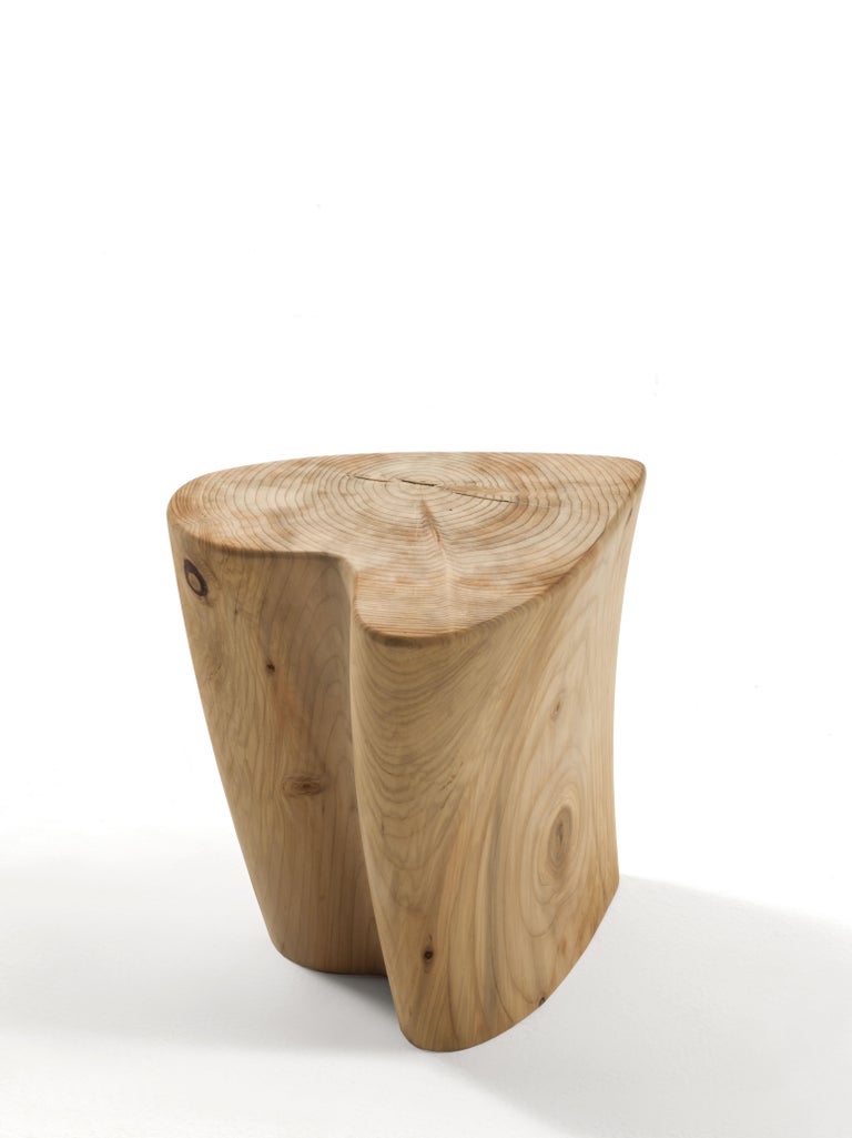 Stool made from a single block of scented cedar that reproduces the form of a heart.