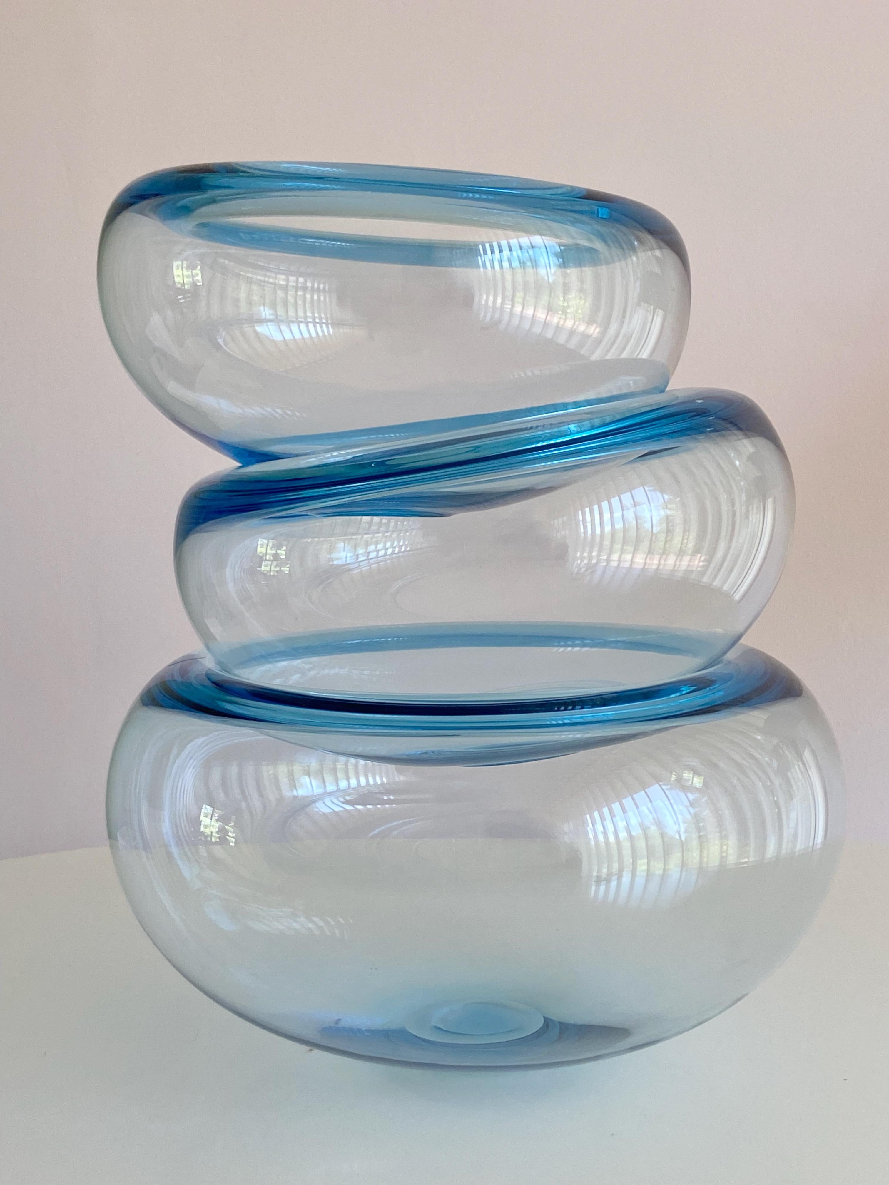 Medium size hand-blown light blue glass bowl designed by Per Lütken and manufactured by Holmegaard in Denmark. 
Price for one bowl, more available.