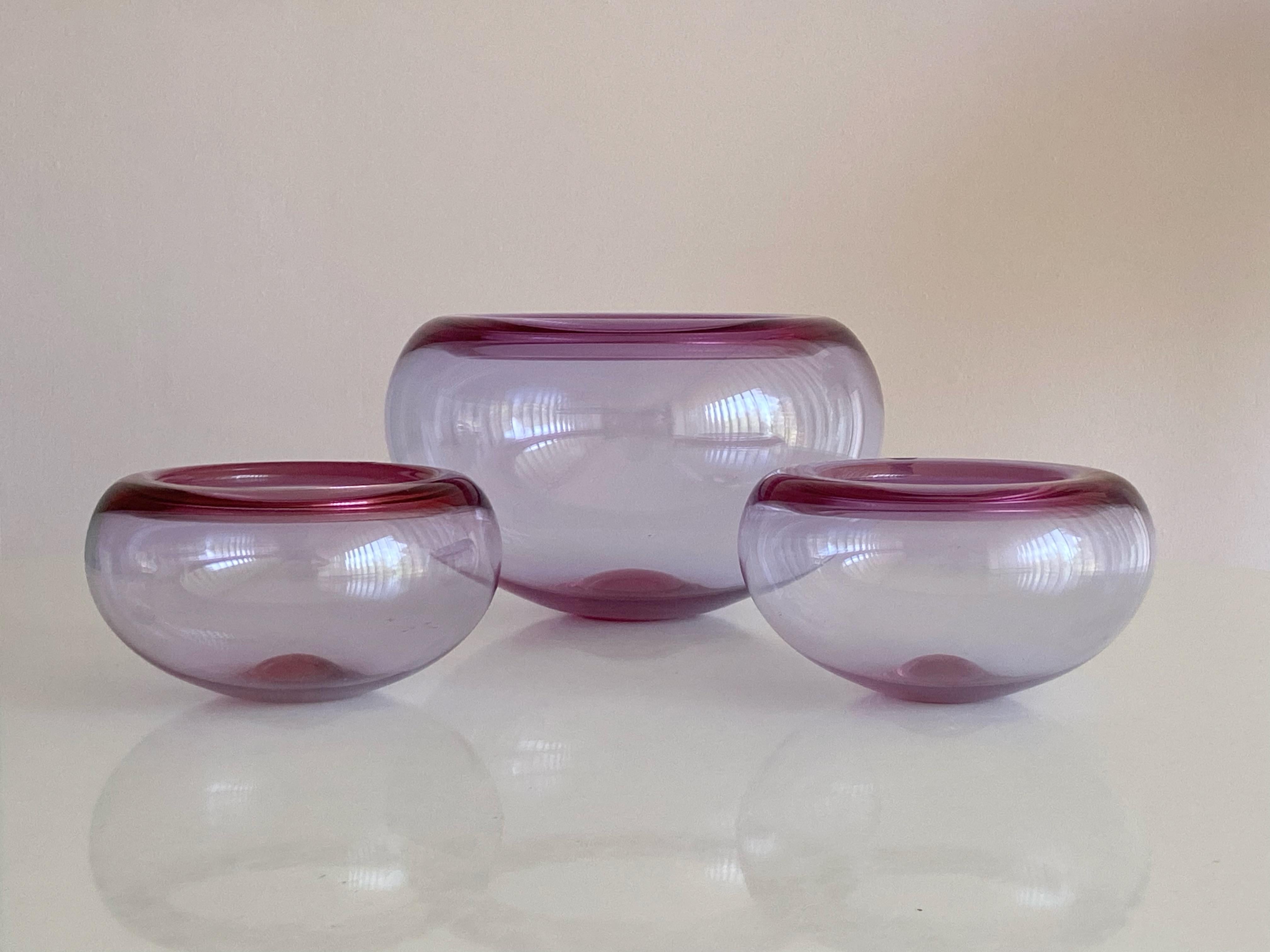 Medium size hand-blown light purple glass bowl designed by Per Lütken and manufactured by Holmegaard in Denmark. 
Price for one bowl, more available.