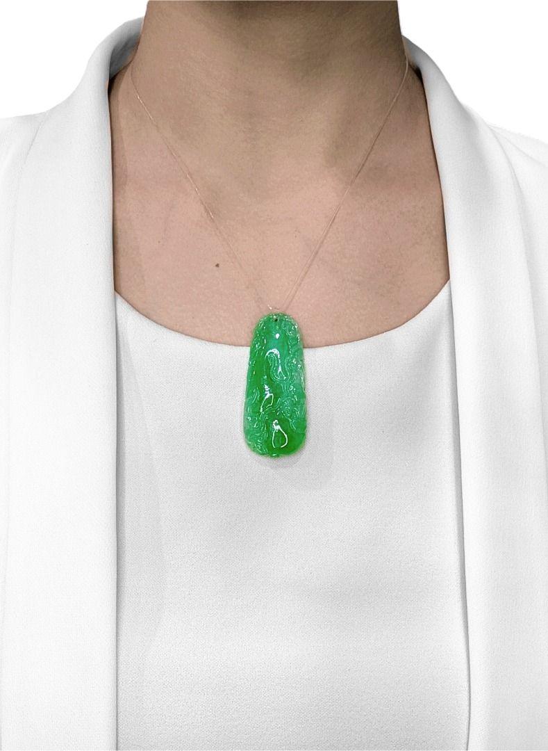 Discover unparalleled artistry with this exquisite new jadeite pendant, a truly magnificent piece meticulously carved from genuine Type A jadeite. Weighing an impressive 108.83 carats, this substantial pendant features a captivating carving of a