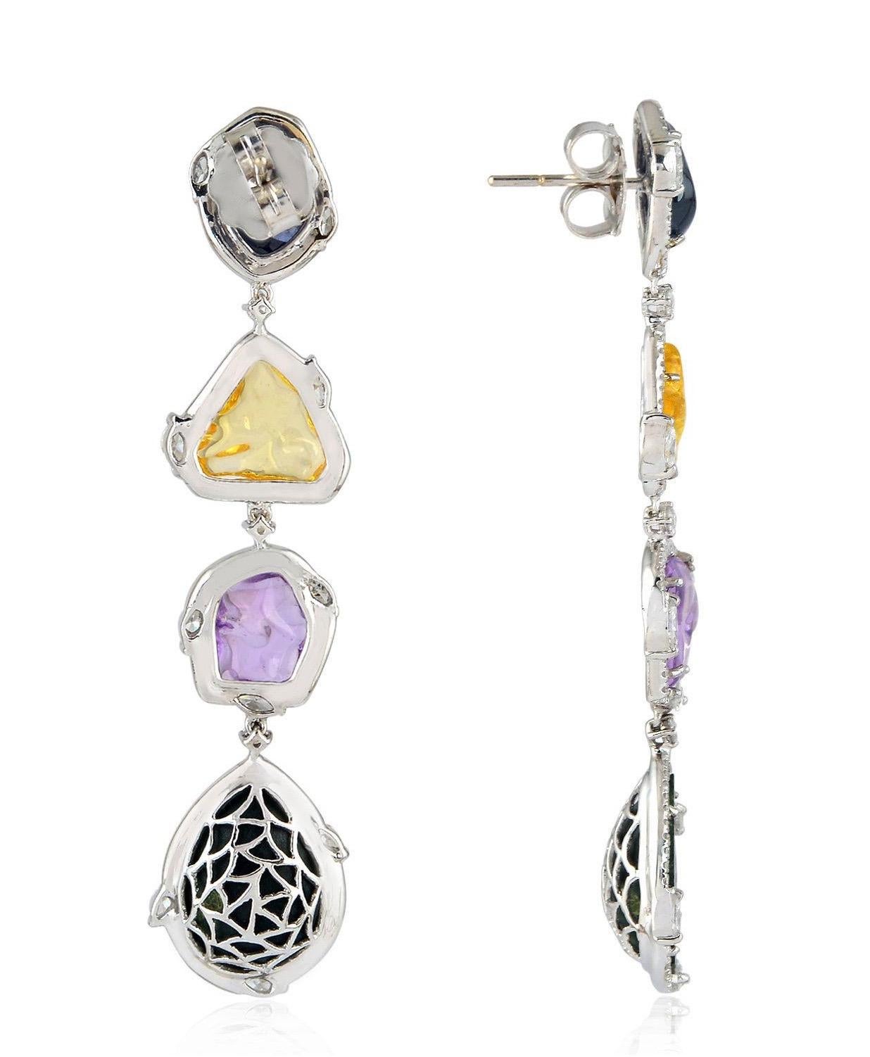 These one of a kind drop earrings are handcrafted with 18-karat gold, features tier drop geode stones & sapphire. It is set with 12.97 carats geode, 17.8 carats sapphire and 2.65 carats of diamonds.

FOLLOW  MEGHNA JEWELS storefront to view the