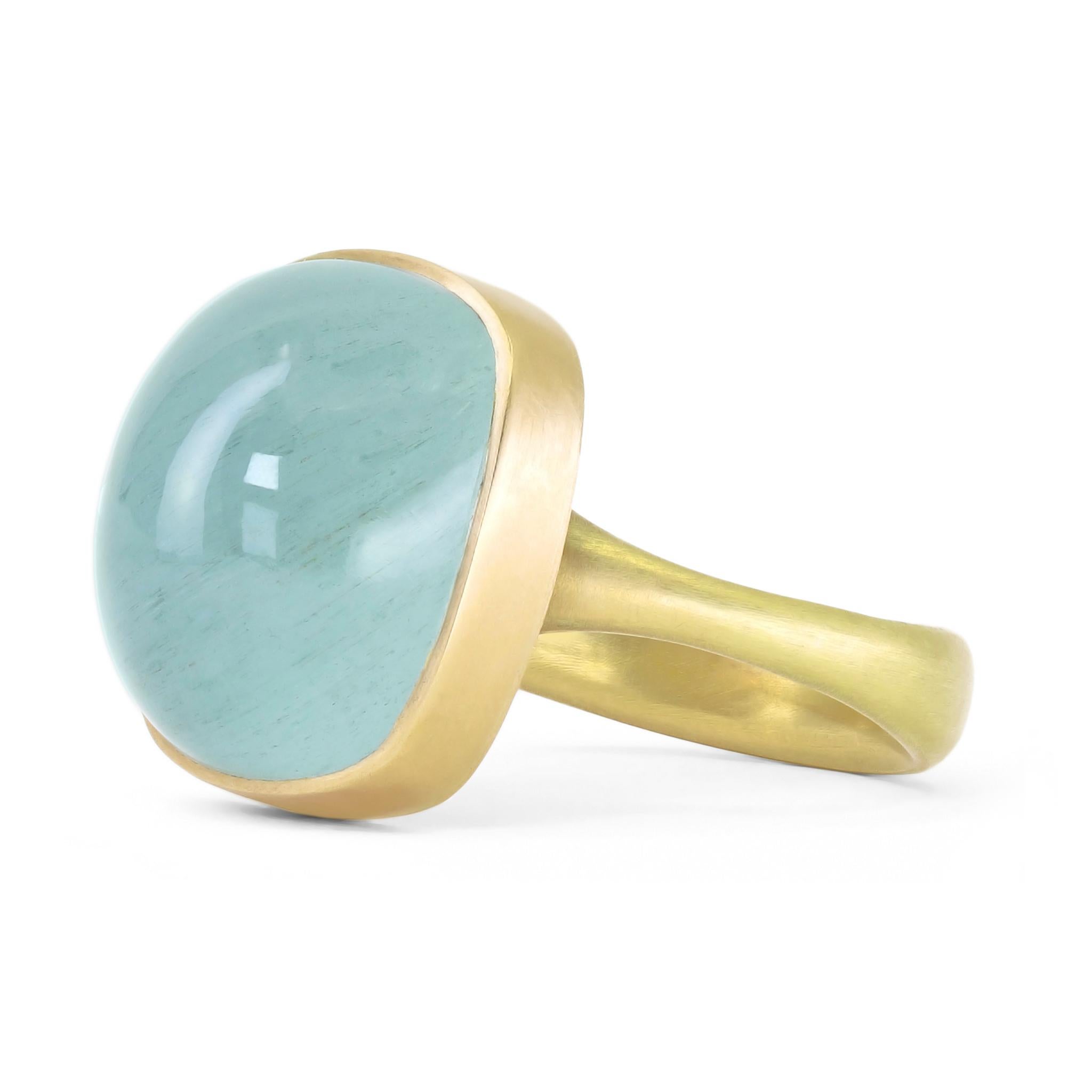 One of a kind Ring hand-fabricated by acclaimed jewelry maker Lola Brooks in the artist's signature-finished 18k yellow gold showcasing a stunning sea-foam greenish blue 16.67 carat aquamarine cushion cabochon, with subtle glow. Size 6.75 (can be