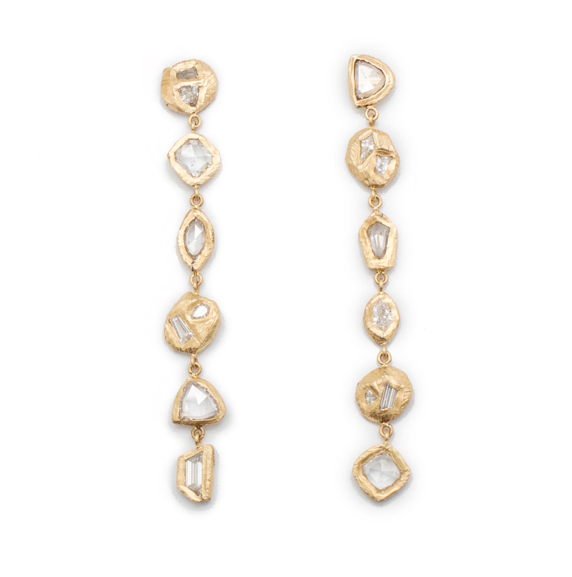 18kt yellow gold earrings with six hand carved settings on either side with 3.16 carats of diamonds. 
Handcarved in NYC by artist Page Sargisson. These earrings are truly one of a kind.