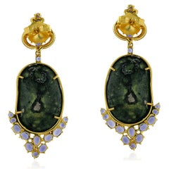 Boucles d'oreilles uniques en leur genre en or 18 carats, diamants et iolite en forme de géode