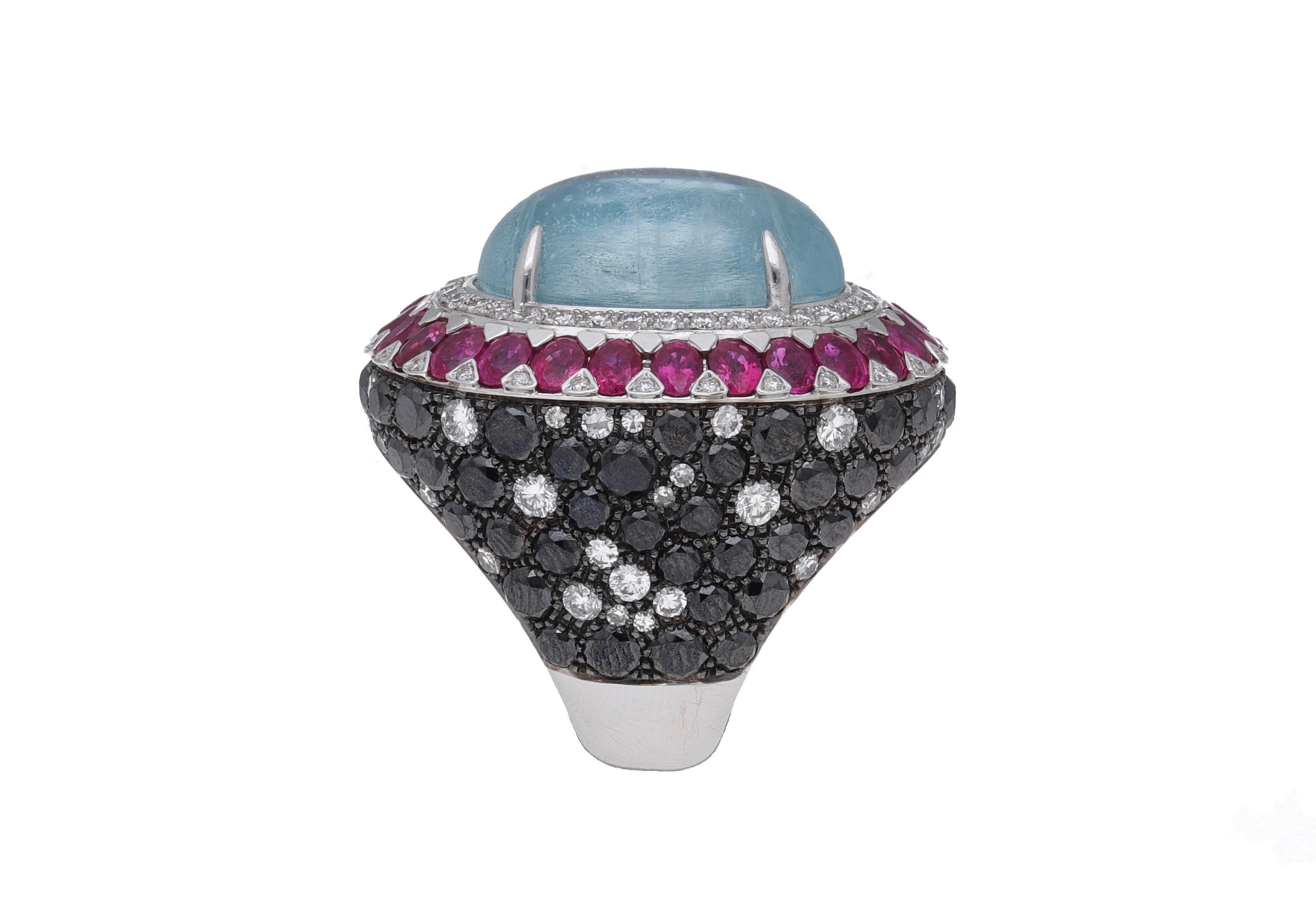 18 kt. white gold cocktail ring with 2.44 carats of round-cut diamonds ( H-I color / VVS1-VVS2 ), 9.67 carats of round-cut black diamonds, 6.29 carats of oval-cut rubies and 26.22 carats of aquamarine.
This one of a kind ring is entirely hand-made