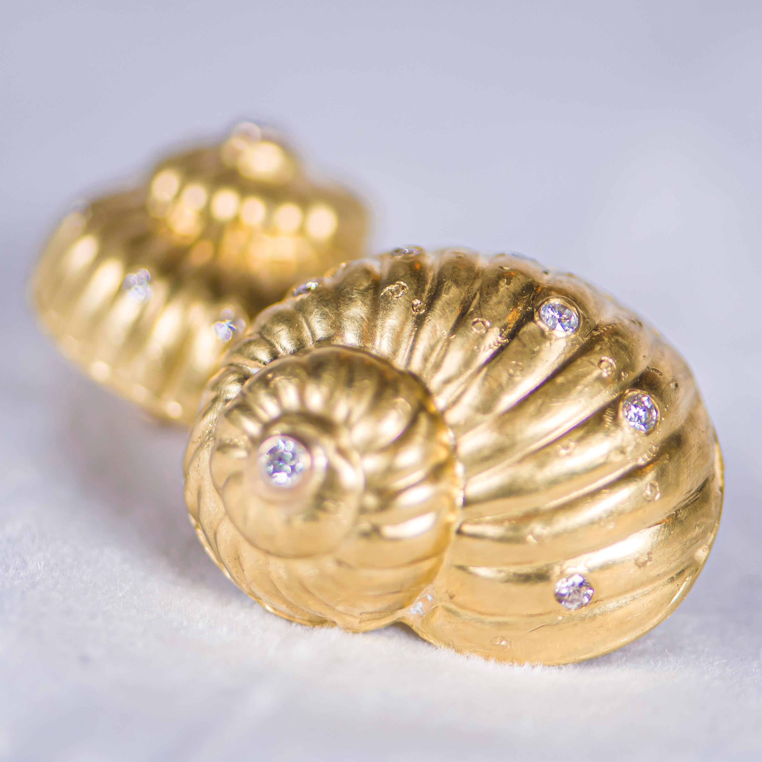 Julia Boss creates one of a kind masterpieces in 18 karat gold.  These stunning nautilus shells have clip on back which can be converted to pierced by your professional jeweler.  Enhanced with round faceted white diamonds having a total weight of 1