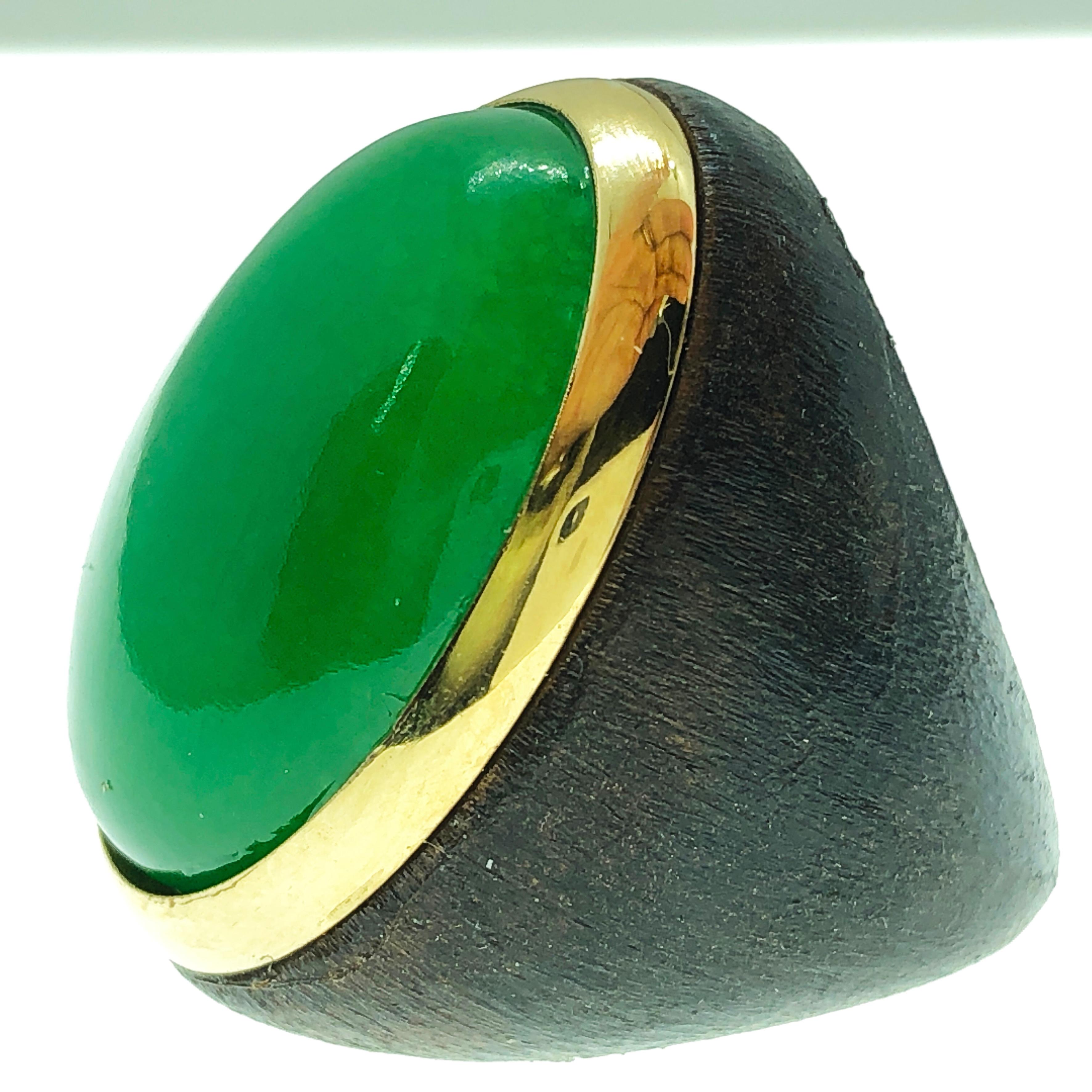One-of-a-kind Contemporary Cocktail Ring Featuring a 27 Carat Natural Green Jade Cabochon (0.911x0.666in) in an 18K Yellow Gold Brown Oxidized Brass Setting.
The color-changing of the Green Jade's cabochon combined with the gold and brown brass