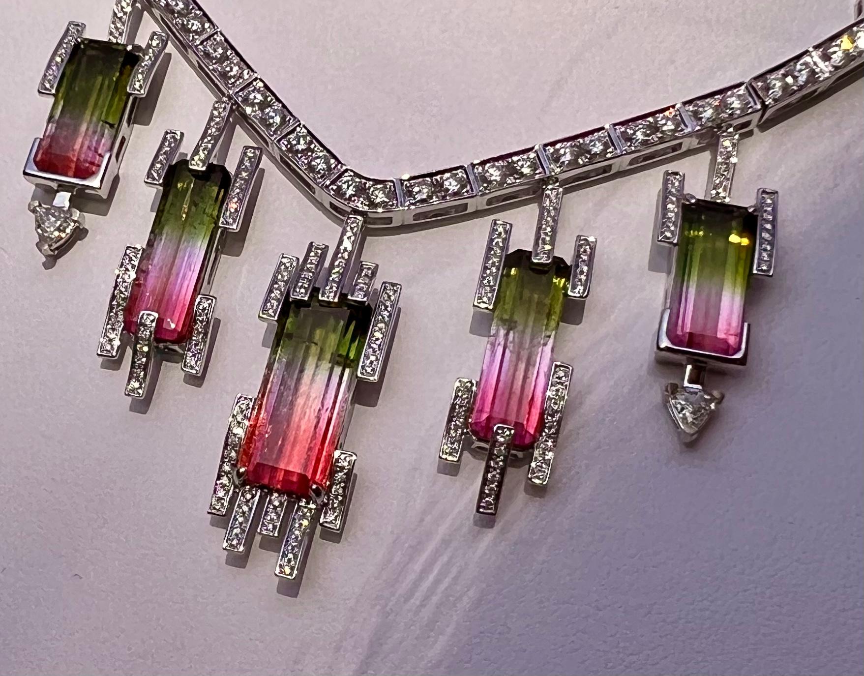 Stunning and very unique, custom made ladies 18 karat white gold 50.88 carat bi-color watermelon tourmaline and diamond 18 karat white gold necklace features 15 Brazilian bi-color emerald cut watermelon tourmalines in various sizes, perfectly