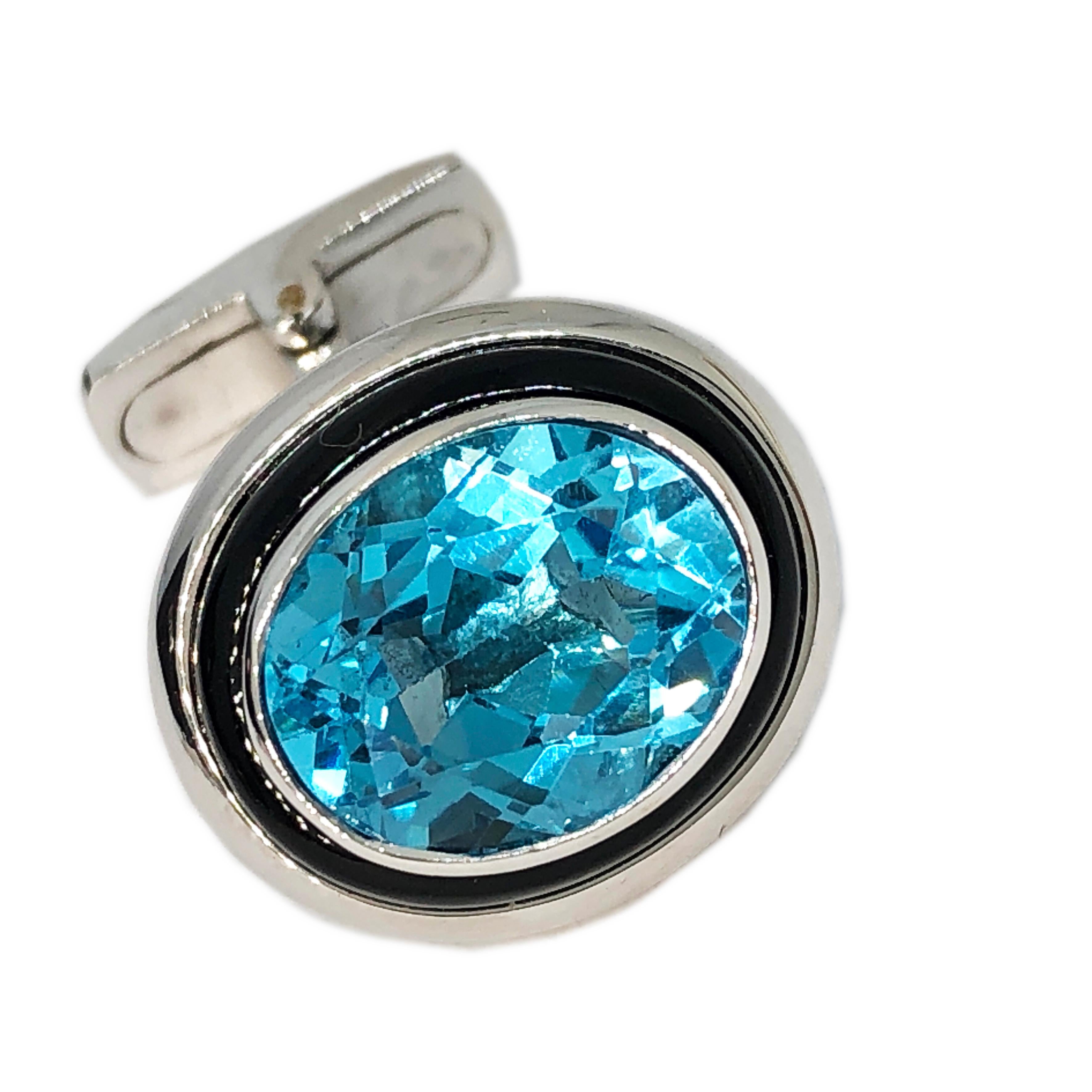 Fabulous, One-of-a-kind 8.97 Carat Oval Blue Topaz Hand Inlaid Onyx 13.30g 18k White Gold Setting Cufflinks, t-bar back.
A fitted smart Black box and pouch are included.

We are glad to offer Complimentary Express Shipping(24 hours) to the Us and