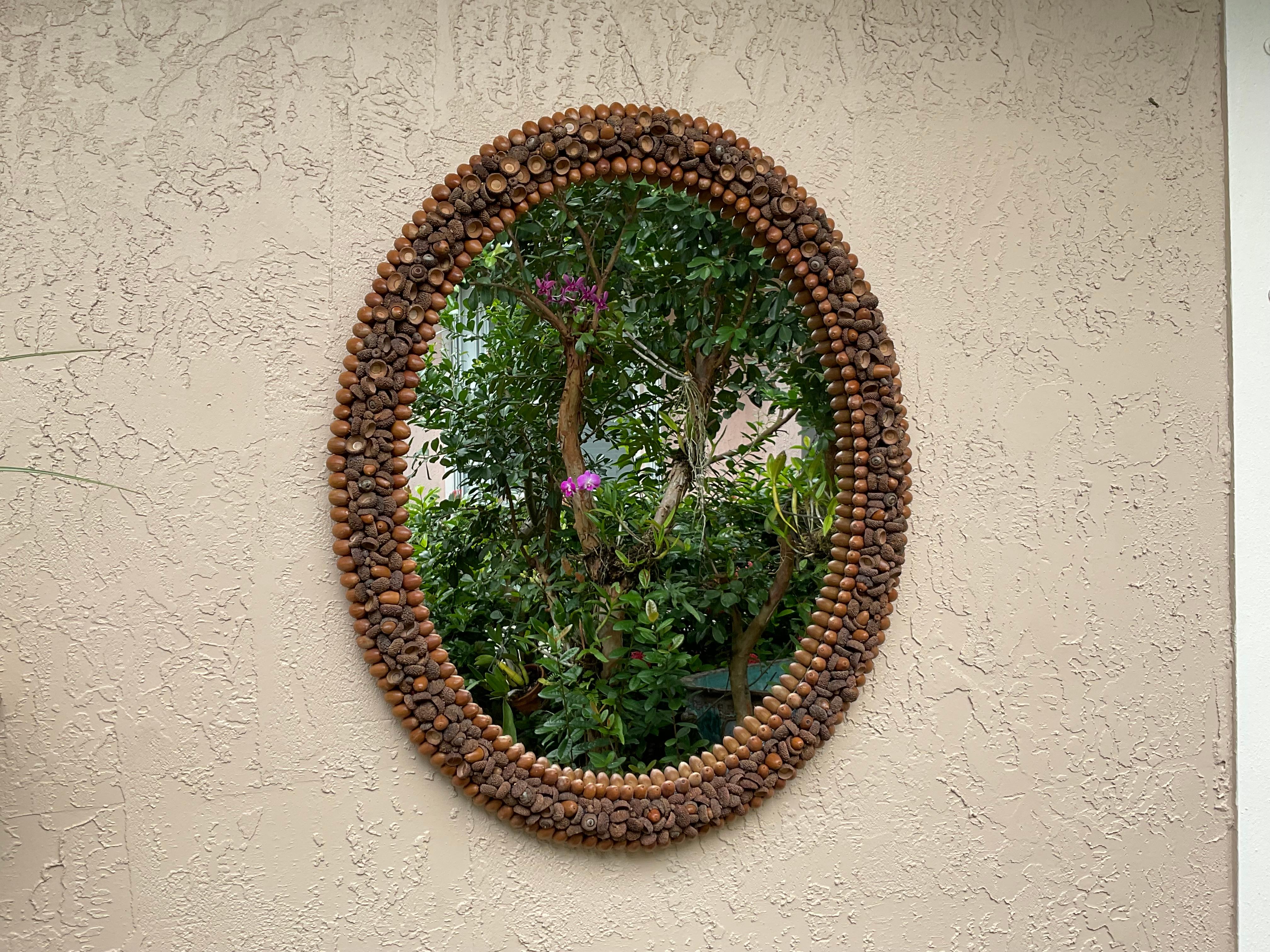 
Exceptional oval mirror, made from natural acorn pieces, is a unique and beautiful piece of art. It can add a touch of nature inspired ambiance and elegance to any room in your home. The mirror is versatile, fitting various interior styles, and is