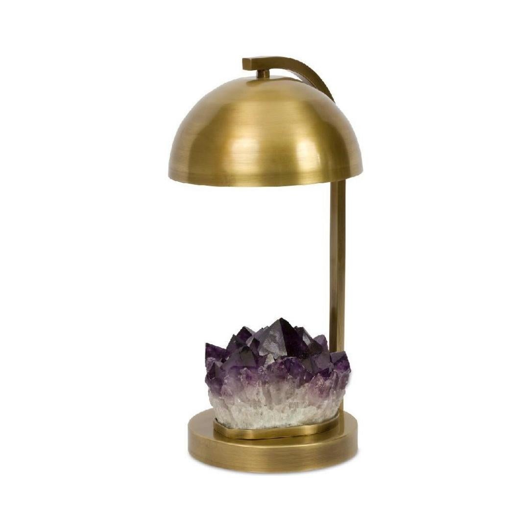 Beautiful Table lamp created with selected amethyst stone and polished brass. 

The process of creation goes through several craftsmen before reaching the final stage, and each craftsman is specialized in one single material or technique.

Each