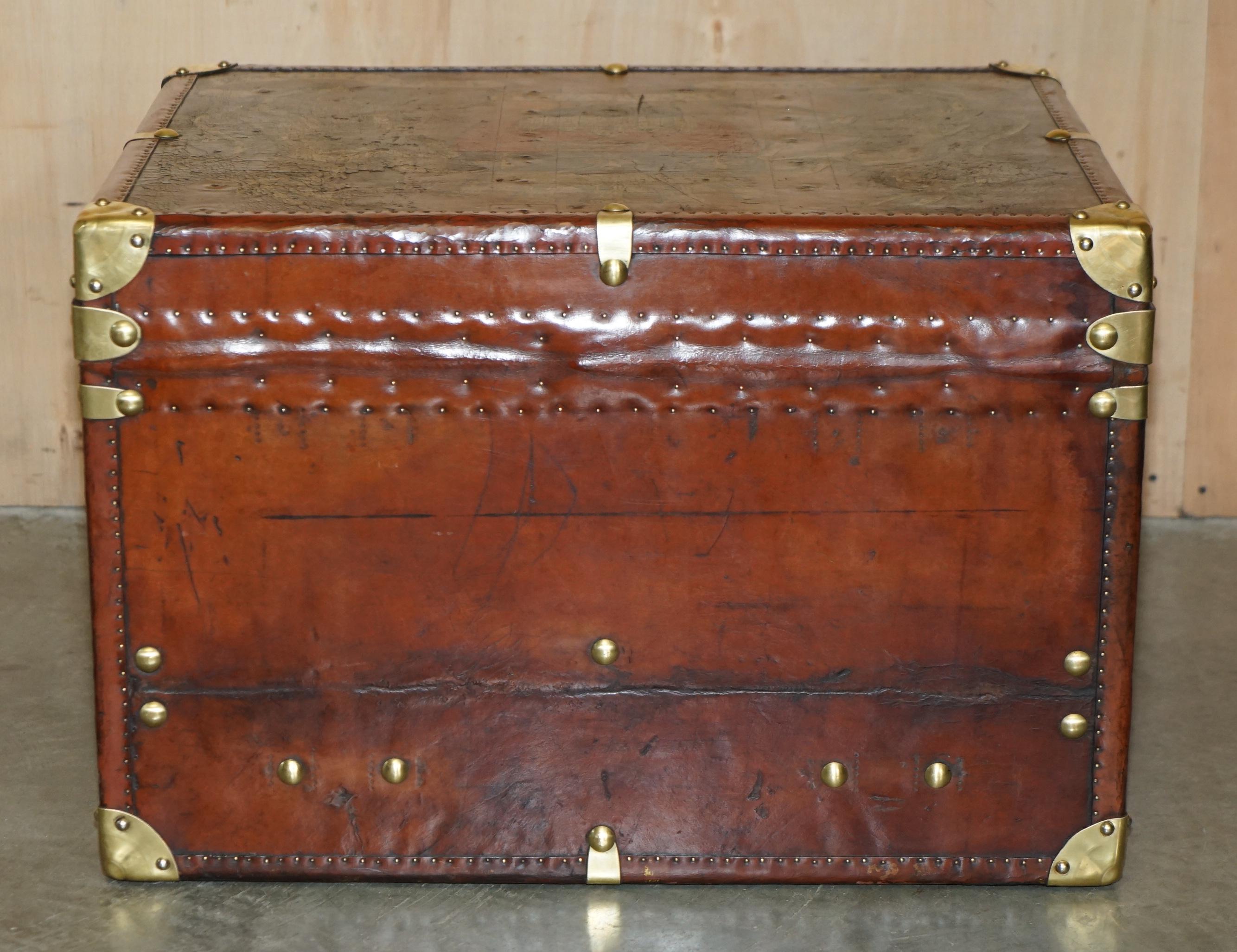 ONE OF A KiND ANTIQUE BROWN LEATHER STEAMER TRUNK WITH ARMORIAL COAT OF ARMS For Sale 8