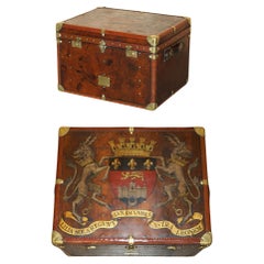 ONE OF A KiND ANTIQUE BROWN LEATHER STEAMER TRUNK WITH ARMORIAL COAT OF ARMS