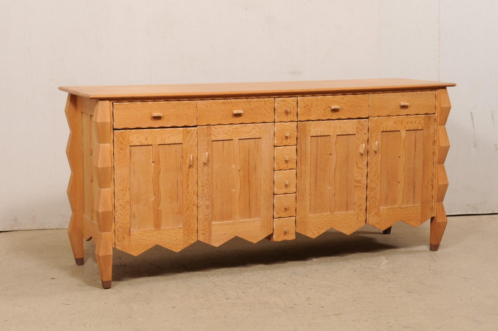 This artisan created, one-of-a-kind credenza cabinet from New England, offers an abundance of storage, in a whimsical and artistic fashion. It bears the artist/woodworker's signature, 