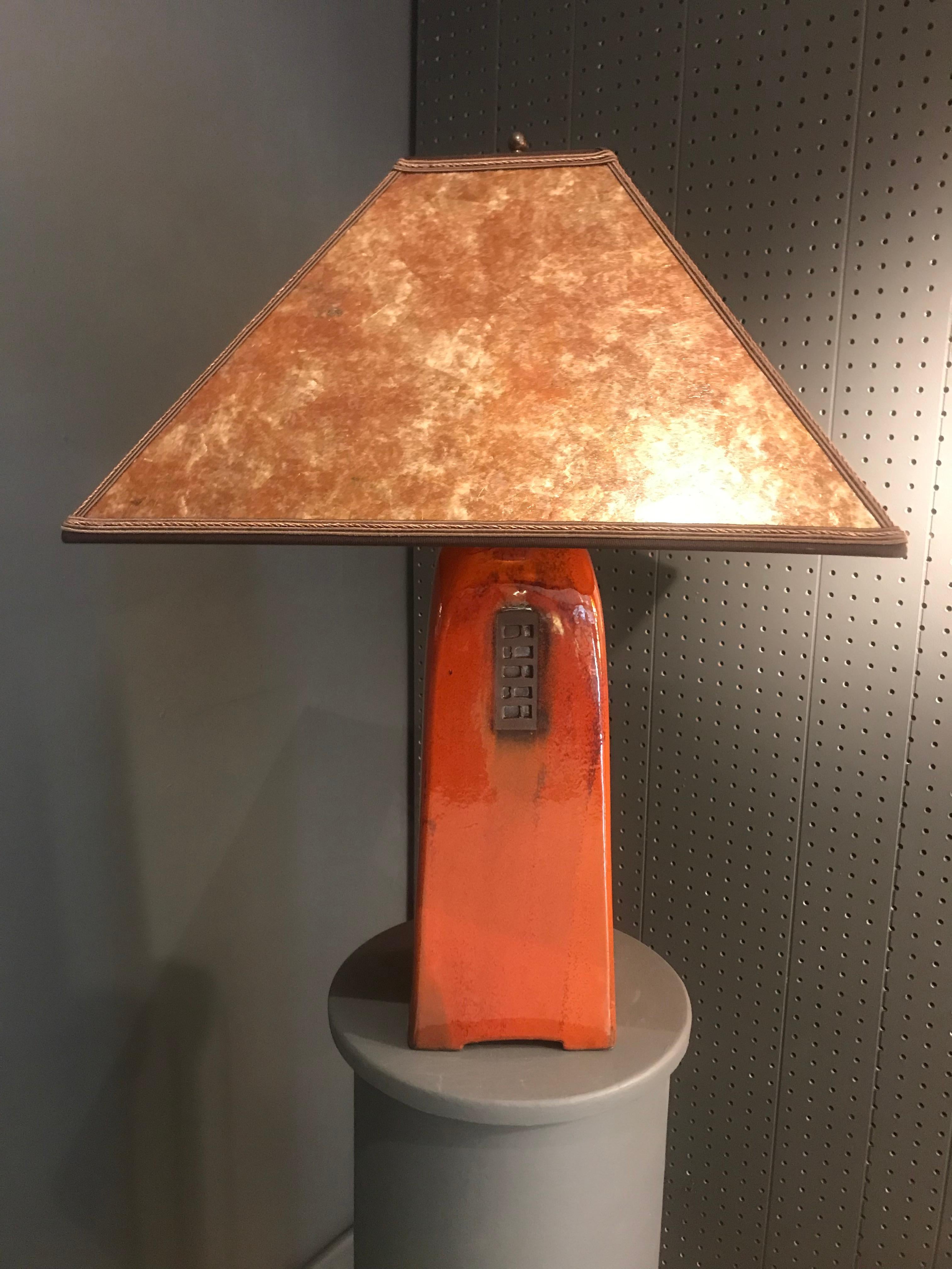 A gorgeous handmade cinnamon colored table lamp by renowned ceramic artist Jim Webb from his North Union Collection, having a russet glaze with amber mica shade. Lamp is high-fired stoneware, skillfully hand-built, signed and numbered inside the